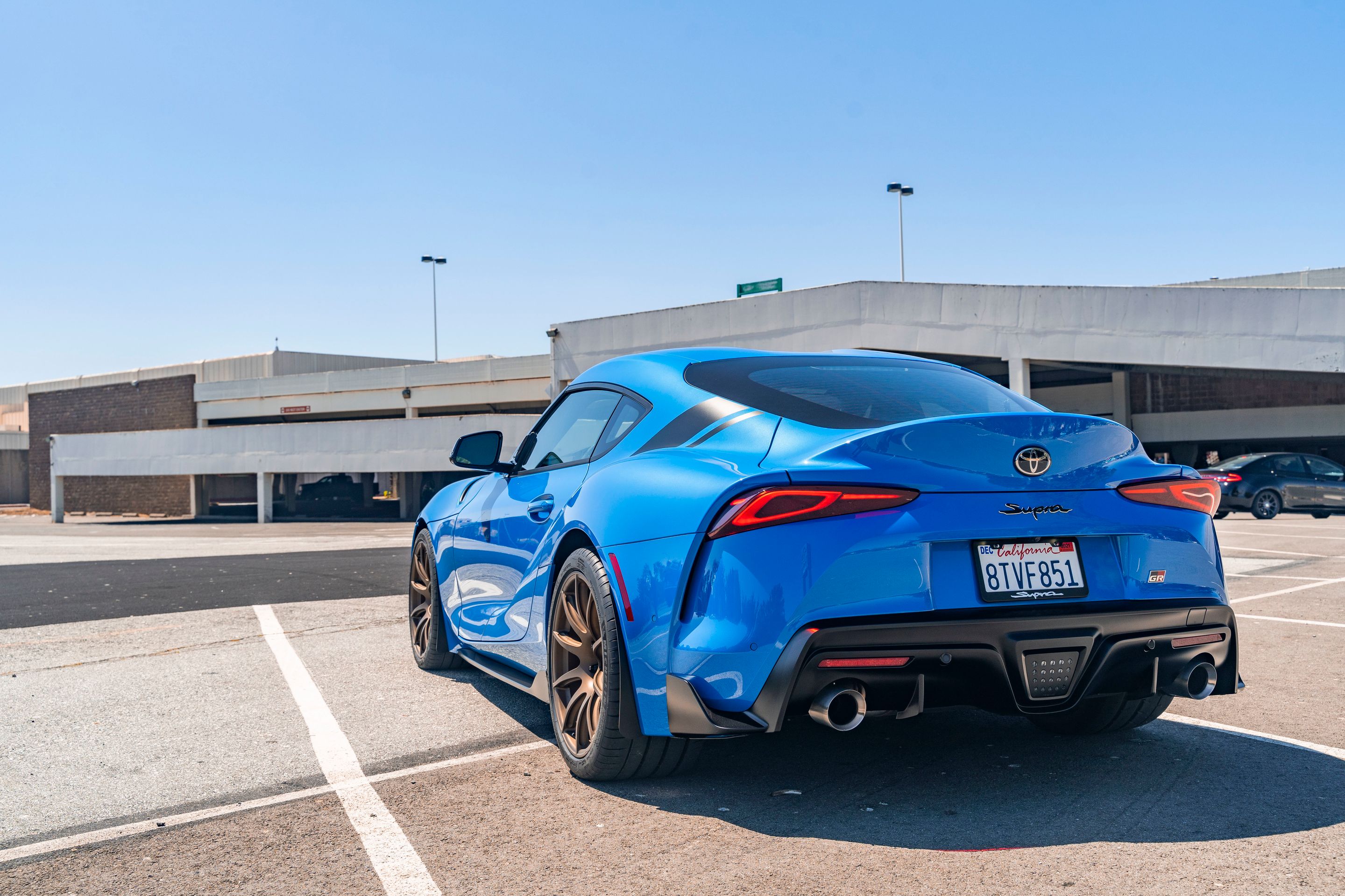 Blue Toyota GR Supra with 19" SM-10 Apex wheels in Satin Bronze