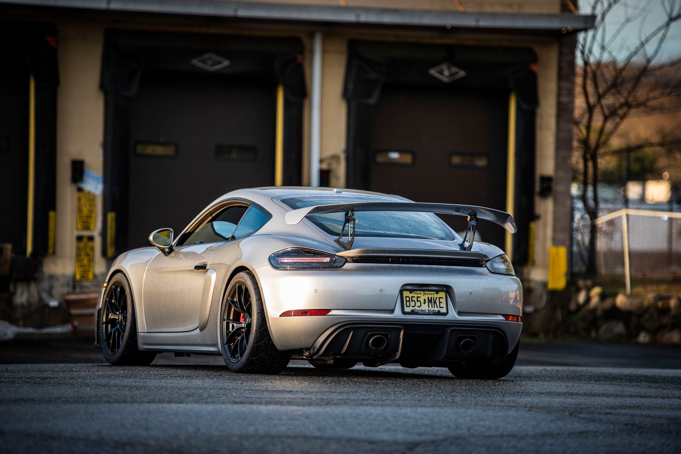 Silver Porsche 718 Cayman GT4 with 19" VS-5RS Apex wheels in Satin Black