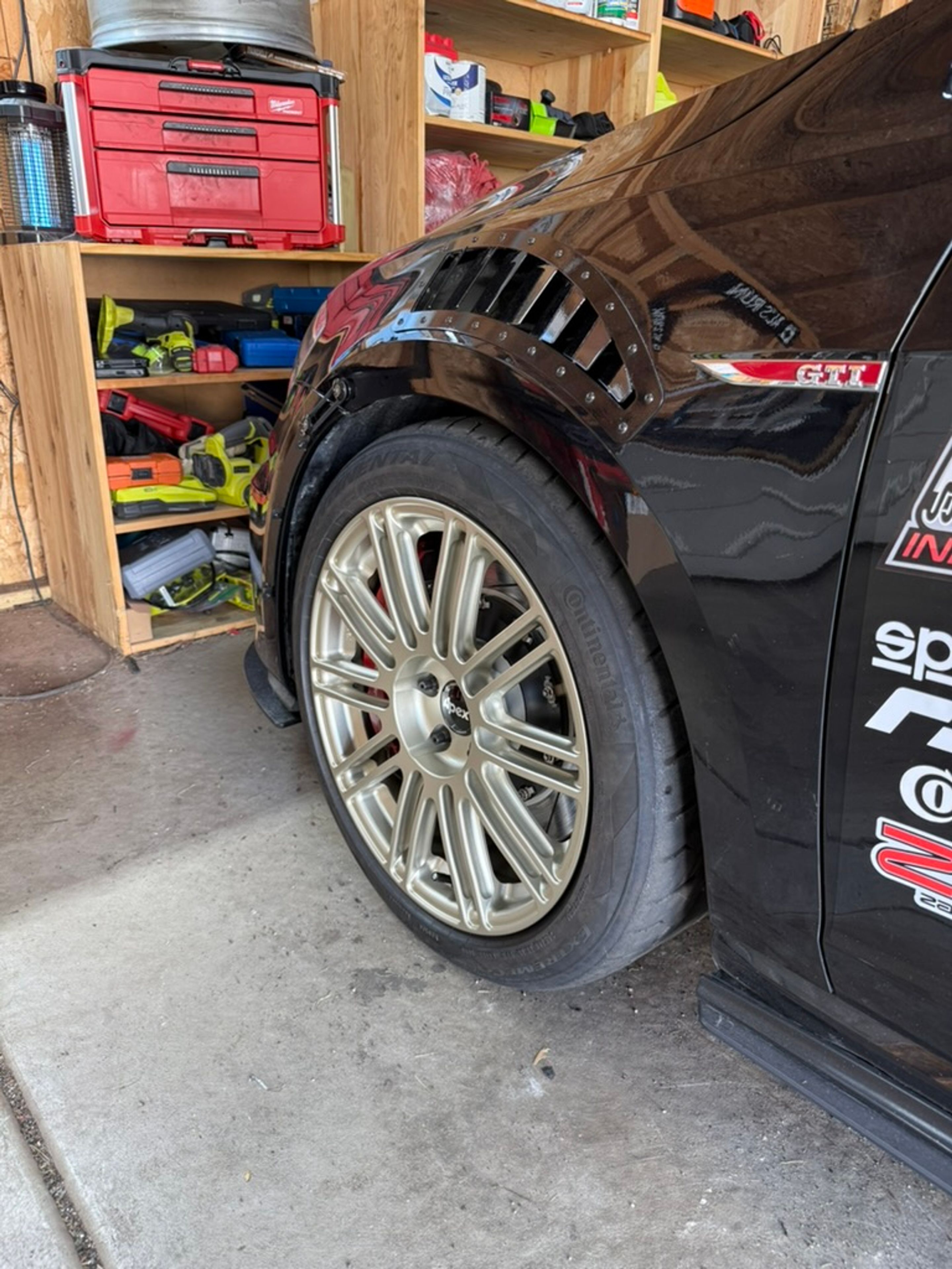 Black VW MK7 GTI with 18" TC-10RT Apex wheels in Motorsport Gold