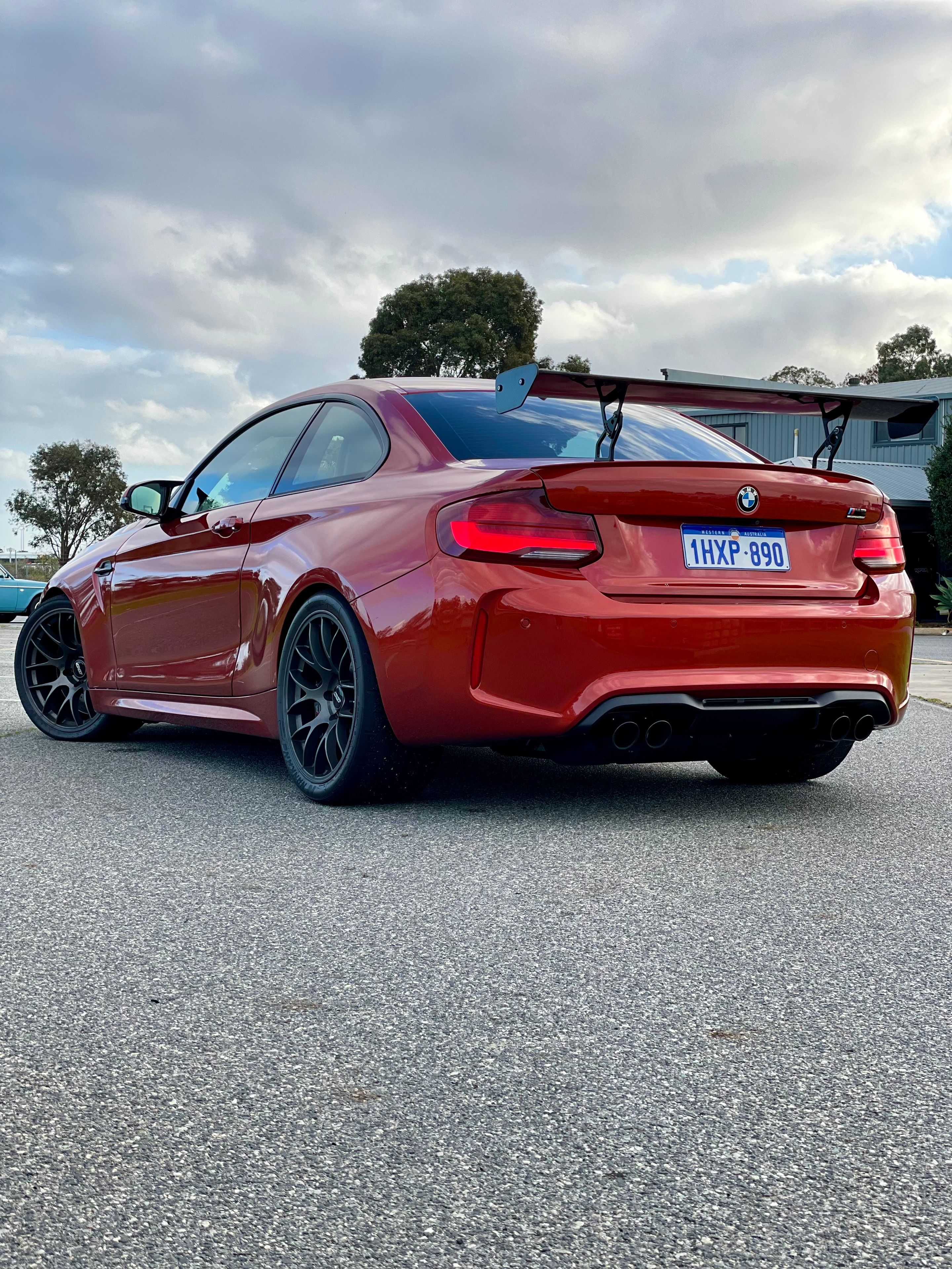 Orange BMW F87 M2 with 19" EC-7 Apex wheels in Anthracite