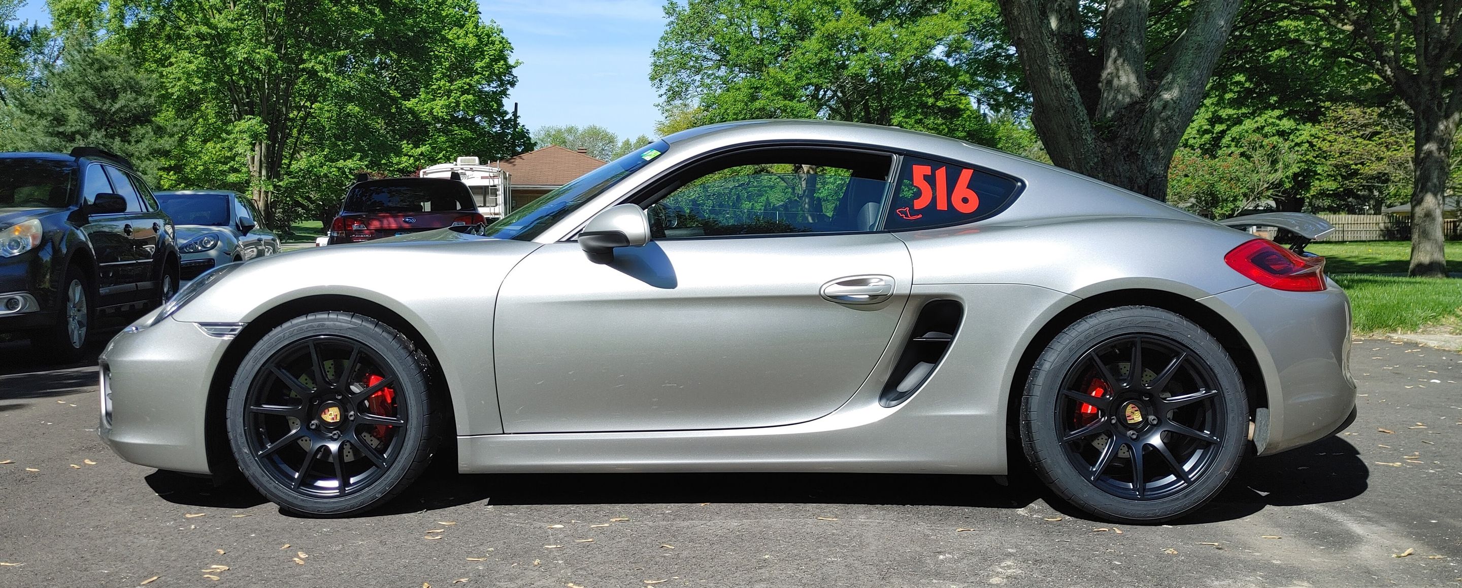 Silver Porsche 981 Cayman S with 18" SM-10 Apex wheels in Satin Black