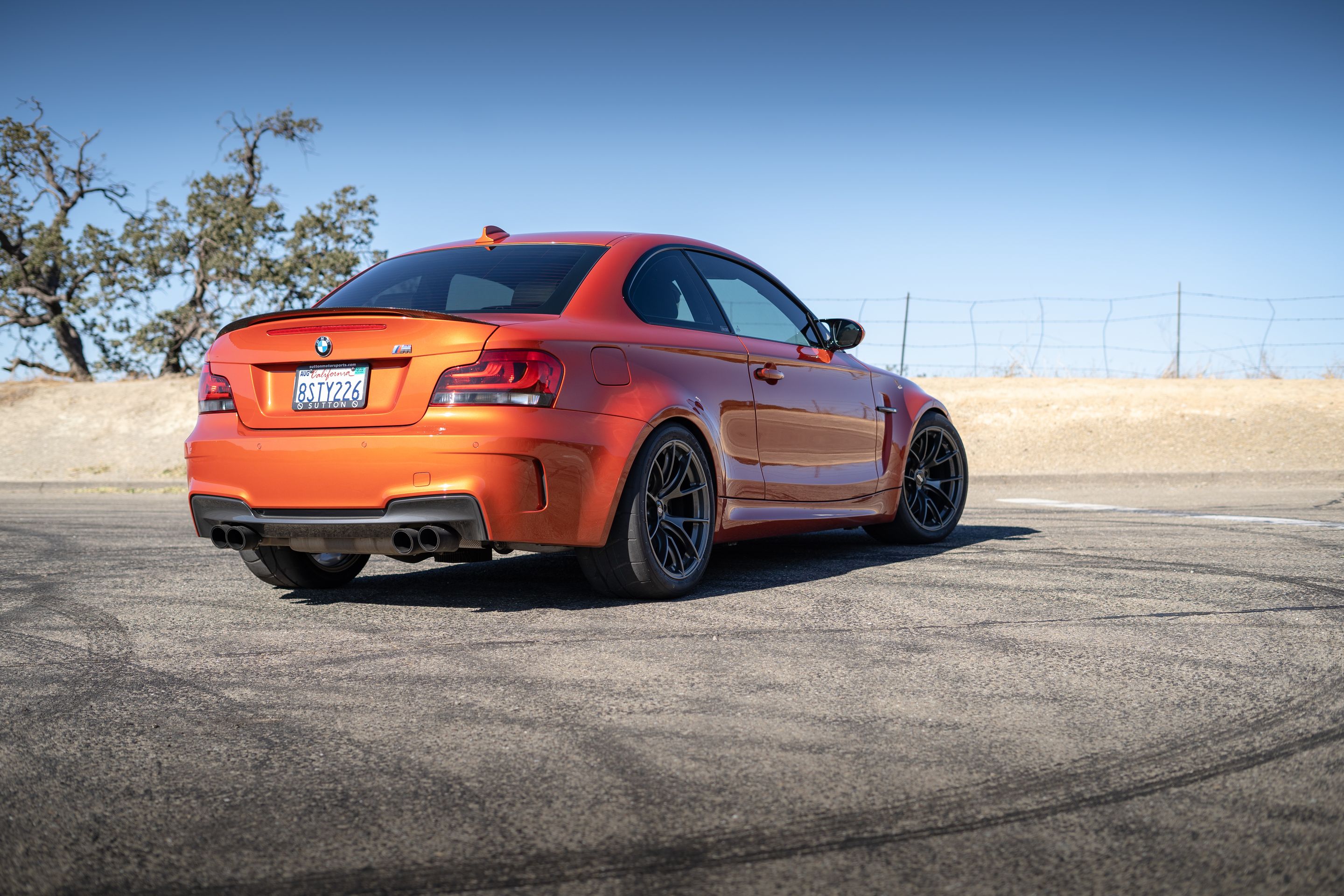 Orange BMW E82 1M with 18" VS-5RS Apex wheels in Anthracite