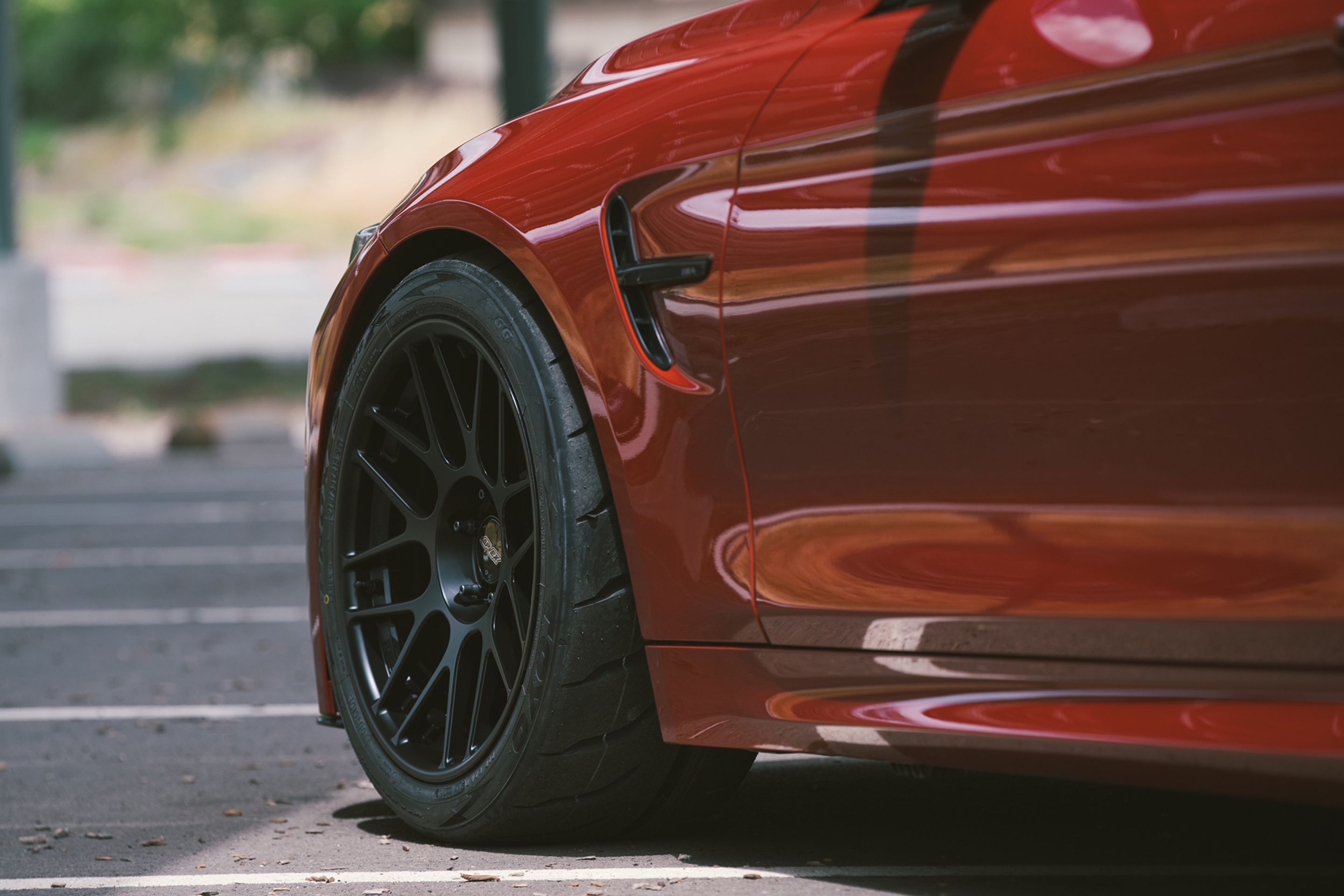 Red BMW F82 Coupe M4 with 18" ARC-8R Apex wheels in Satin Black