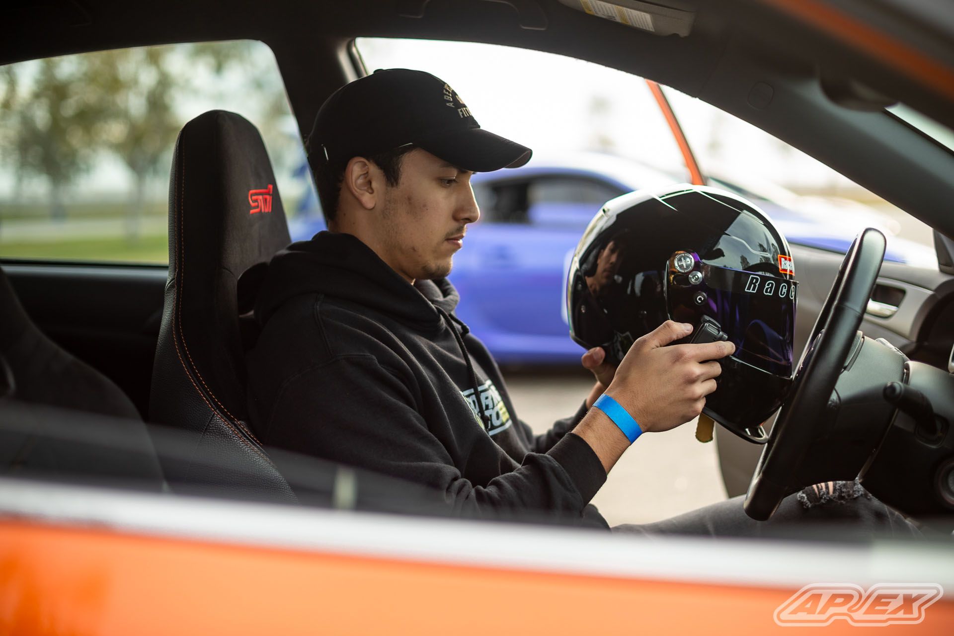 Orange Subaru GR WRX STI with 18" EC-7 Apex wheels in Satin Black