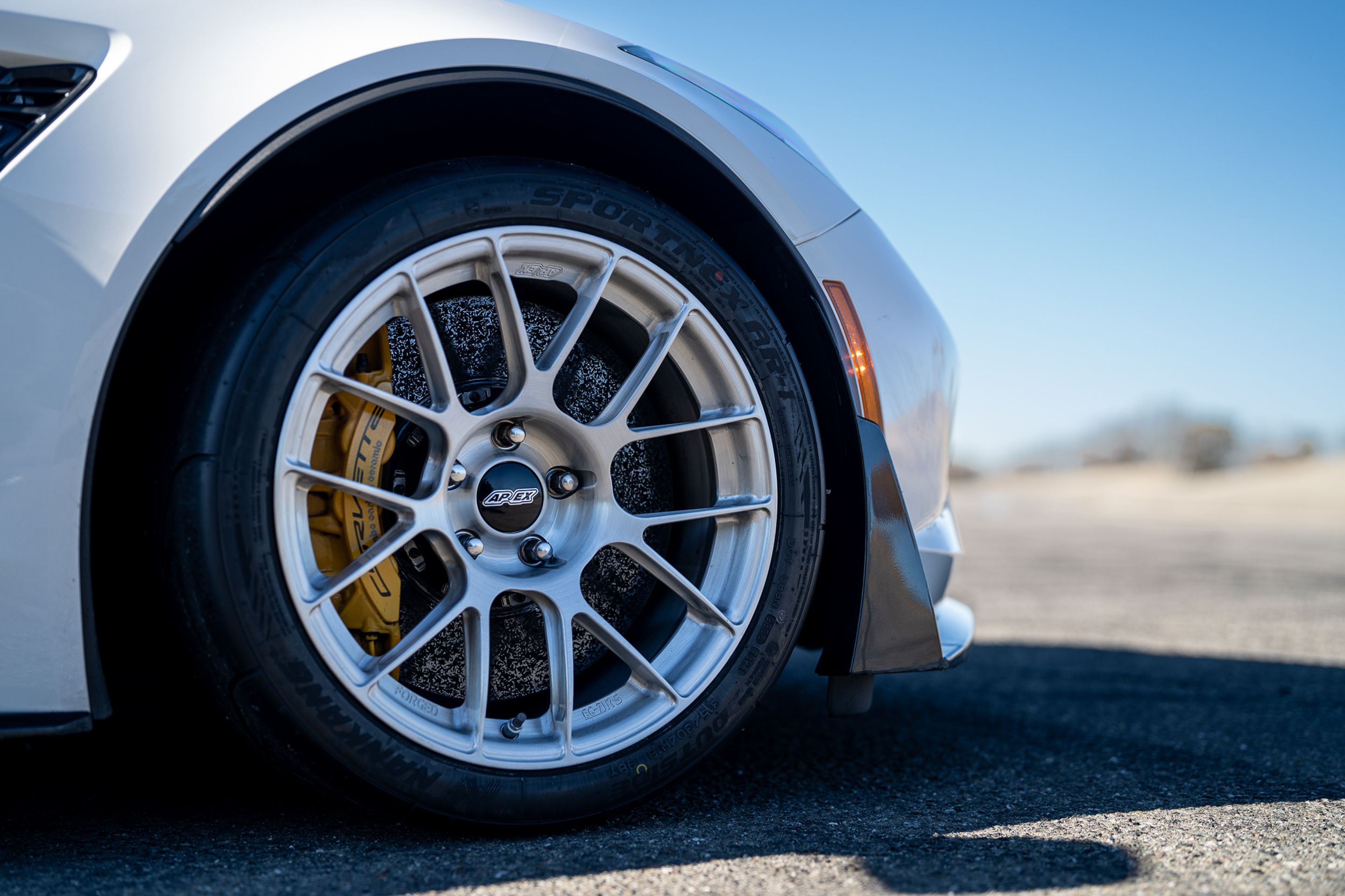 White Chevrolet C7 Corvette Z06 with 18" EC-7RS Apex wheels in Brushed Clear