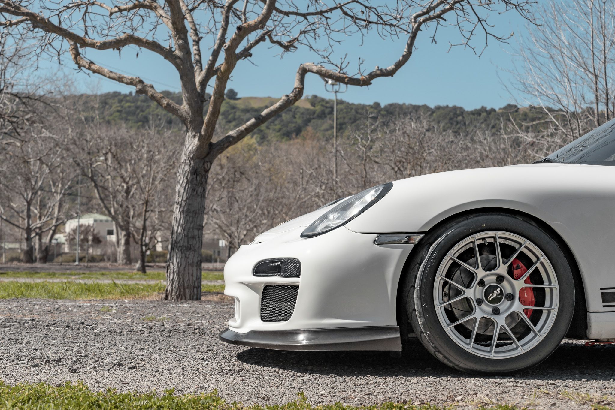 White Porsche 987 Cayman R with 18" EC-7RS Apex wheels in Race Silver