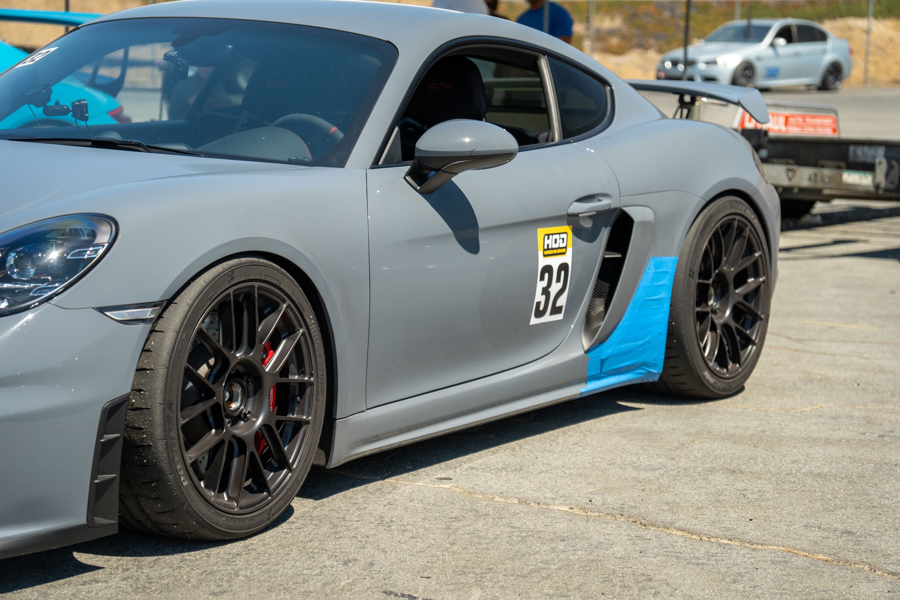 Grey Porsche 718 Cayman GT4 with 19" EC-7RS Apex wheels in Satin Black