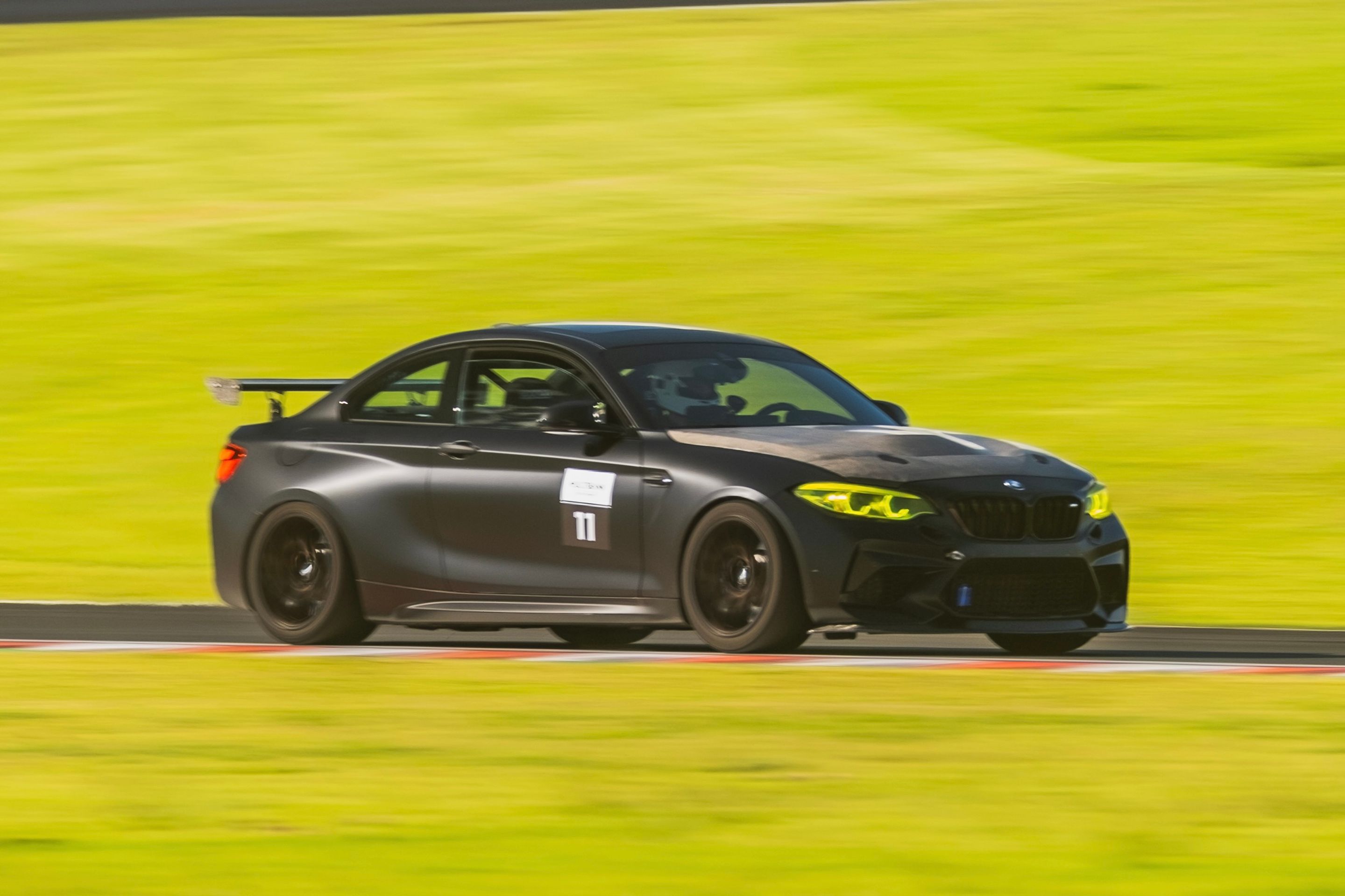 Black BMW F87 M2 with 18" EC-7 Apex wheels in Satin Black