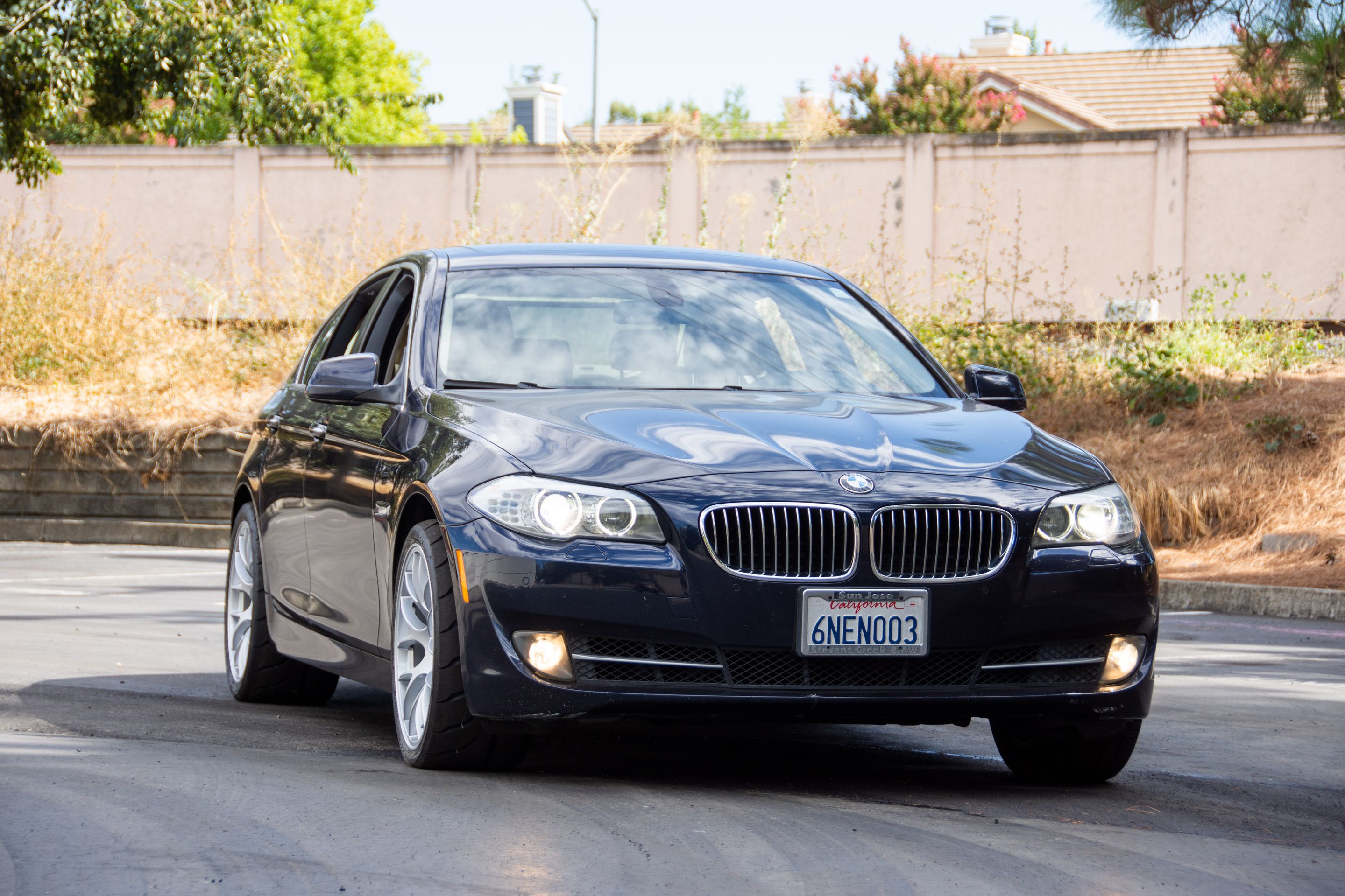 Black BMW F10 Sedan 5 Series with 19" EC-7 Apex wheels in Race Silver