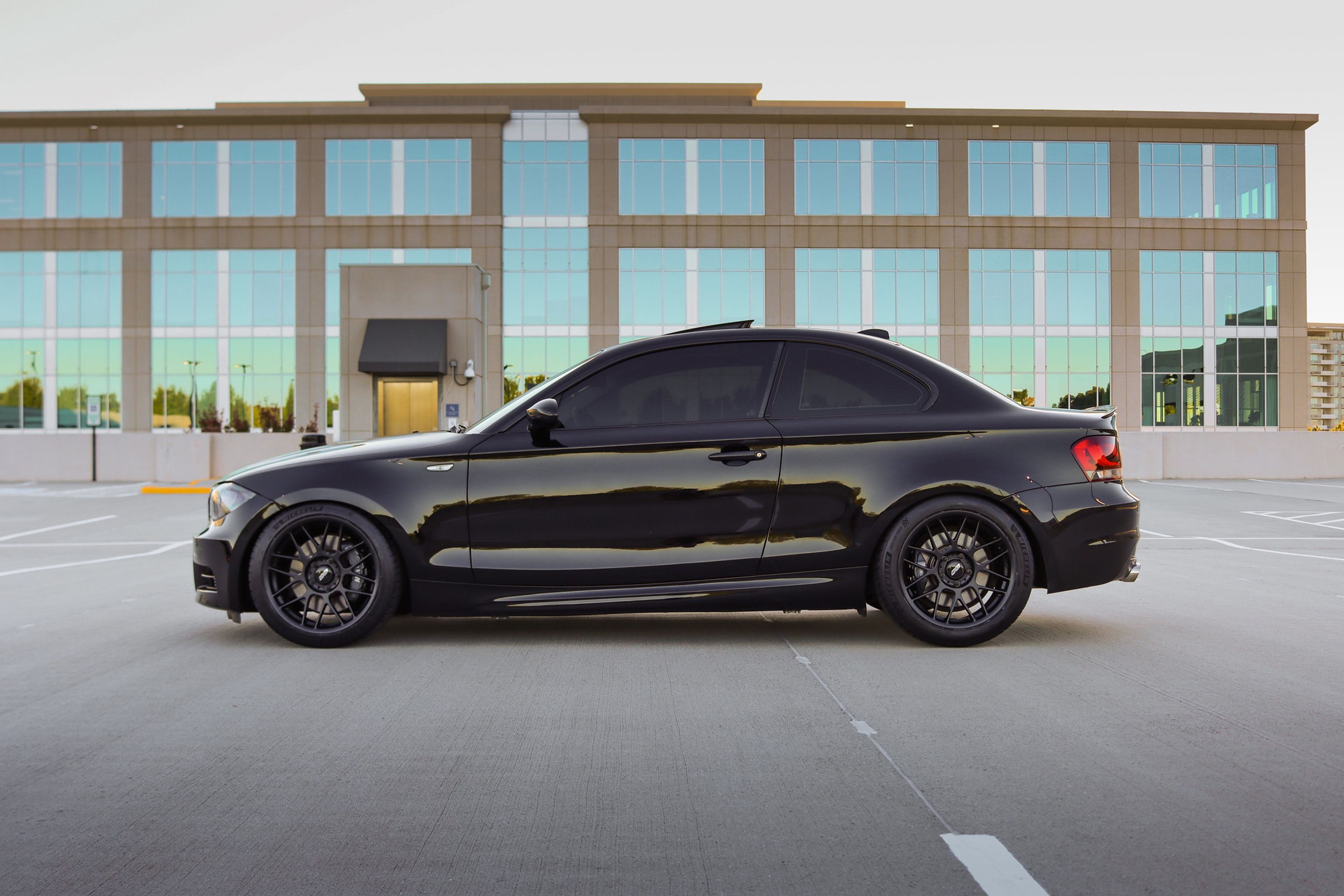 Black BMW E82 Coupe 1 Series with 18" ARC-8 Apex wheels in Satin Black