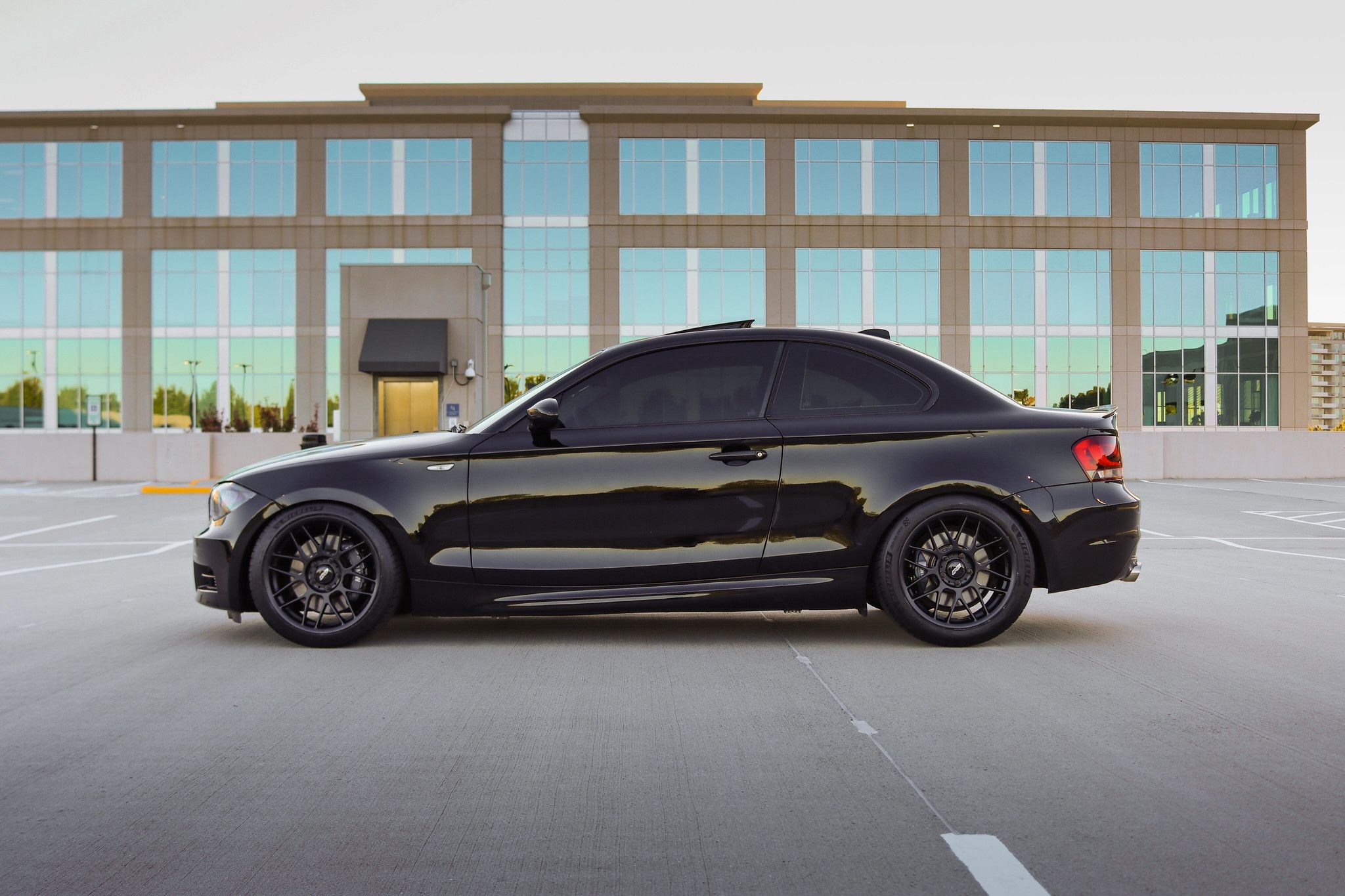 Black BMW E82 Coupe 1 Series with 18" ARC-8 Apex wheels in Satin Black