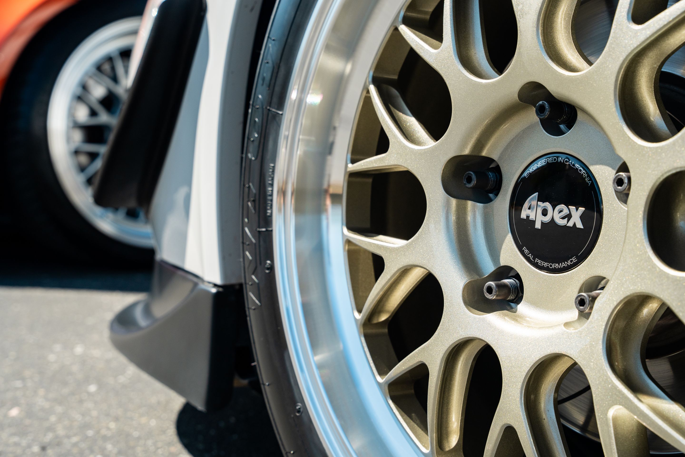 White Porsche 987 Cayman Base with 18" ML-10RT Apex wheels in Machined Lip Gloss Motorsport Gold