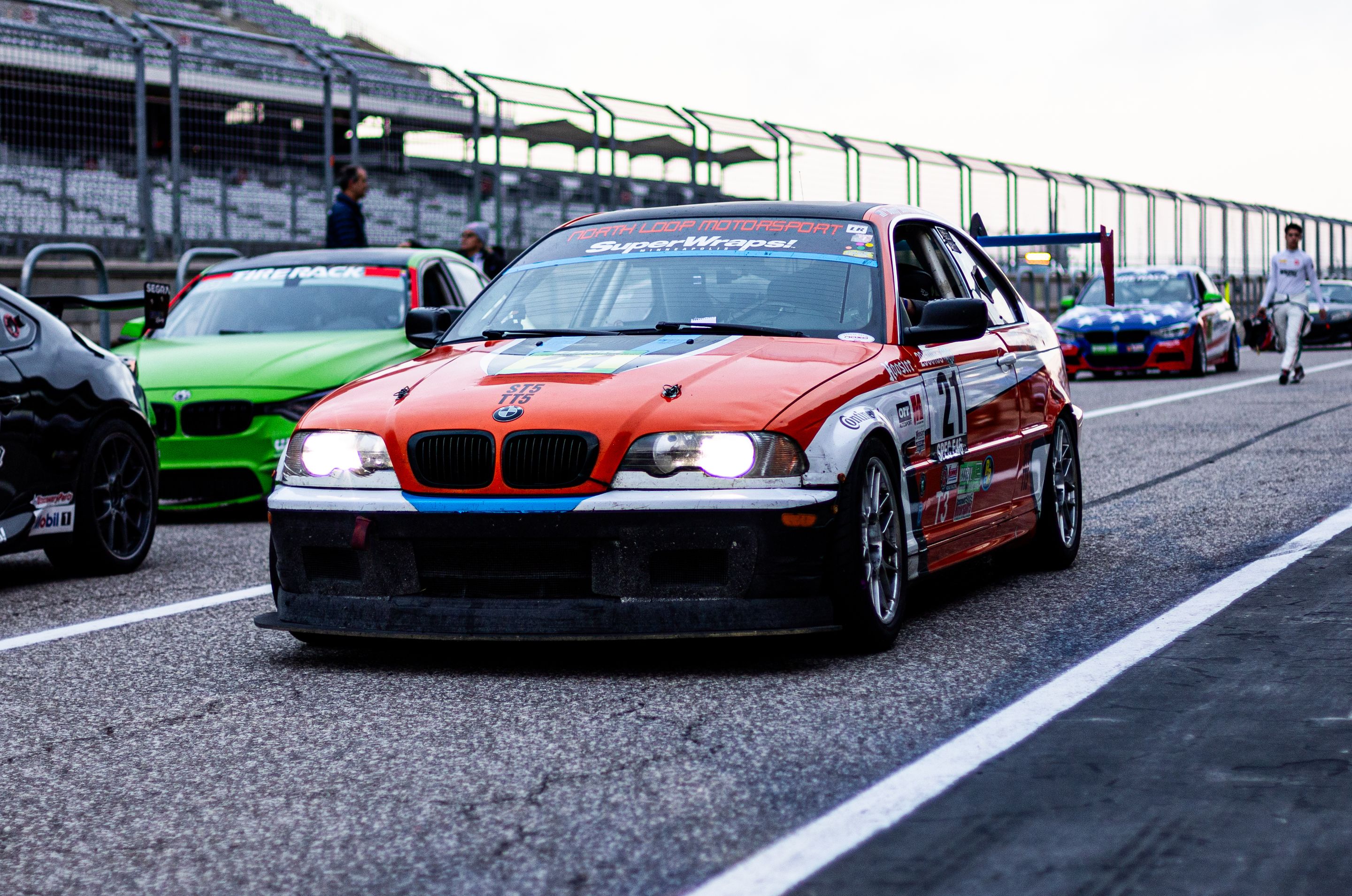 Orange BMW Spec E46 with 17" ARC-8 Apex wheels in Hyper Black