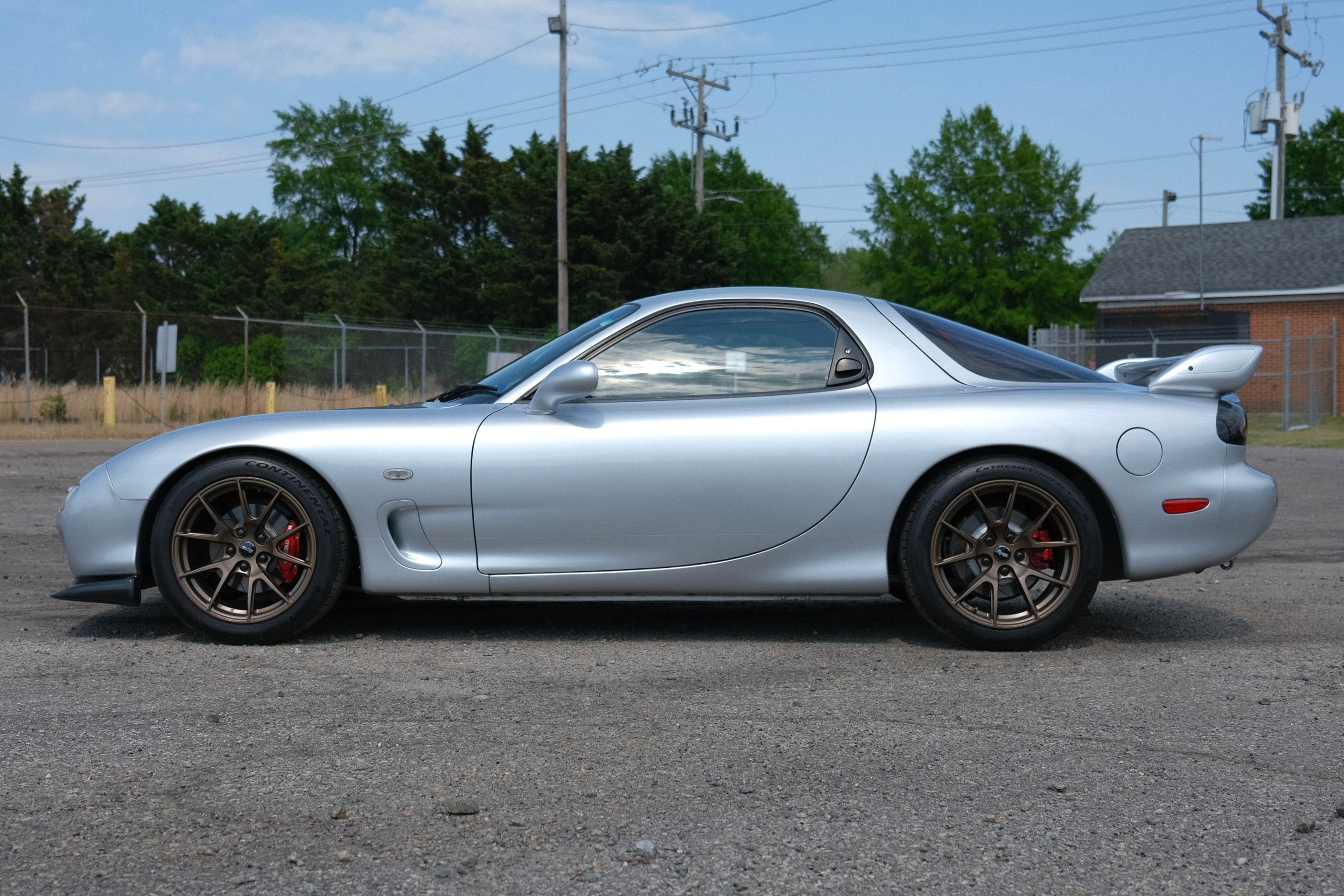 Silver Mazda FD RX-7 with 17" VS-5 Apex wheels in Satin Bronze