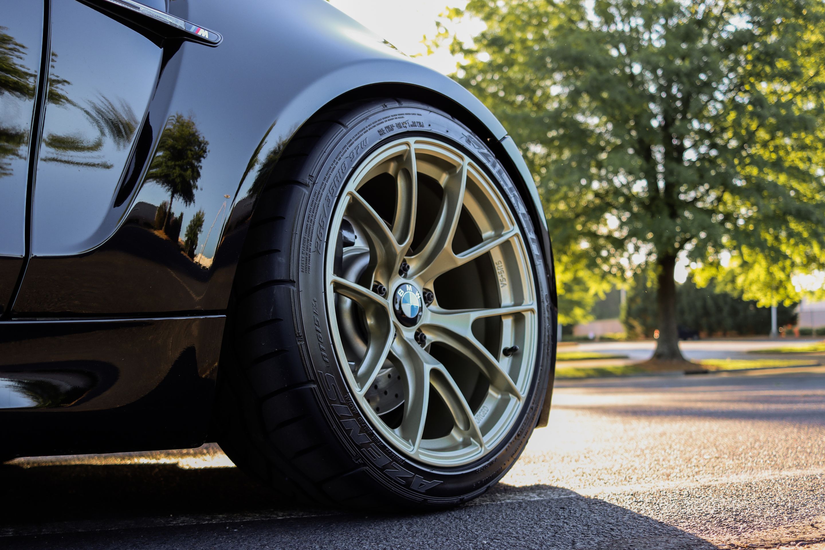 Black BMW E82 Coupe 1 Series with 18" VS-5RS Apex wheels in Motorsport Gold