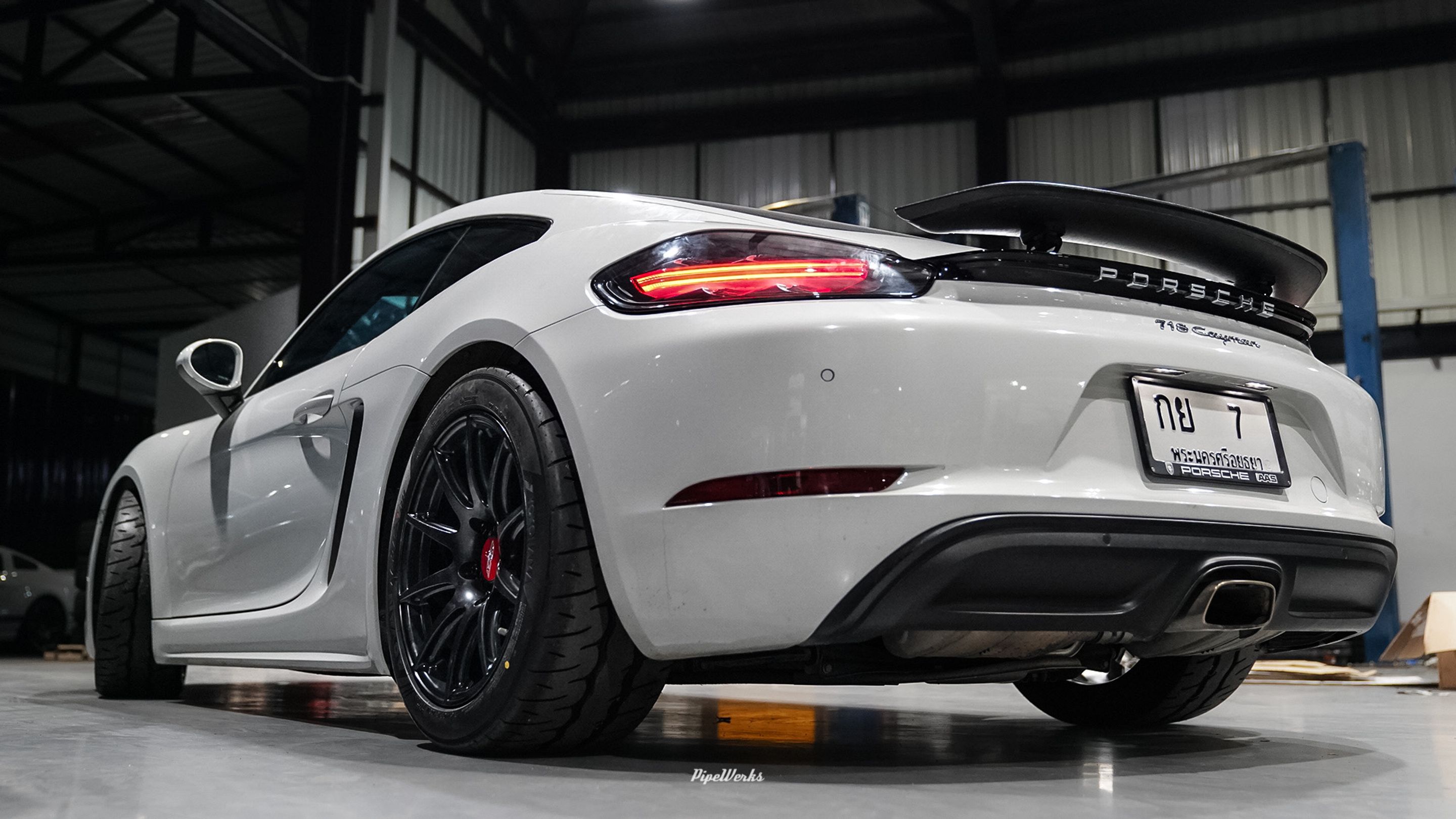 White Porsche 718 Cayman Base with 18" SM-10 Apex wheels in Satin Black