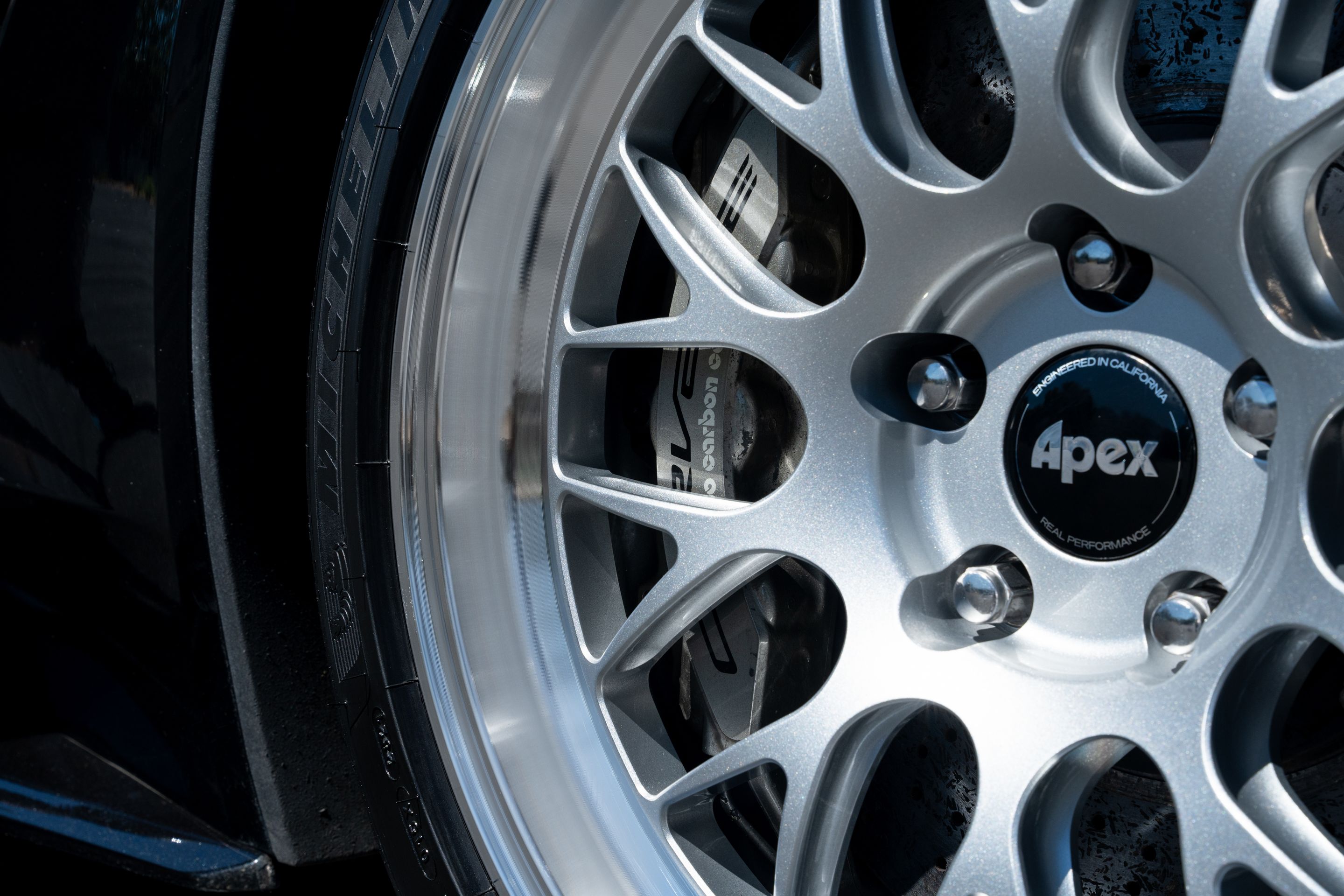 Black Chevrolet C7 Corvette Z06 with 18"/19" ML-10RT Apex wheels in Machined Lip Race Silver