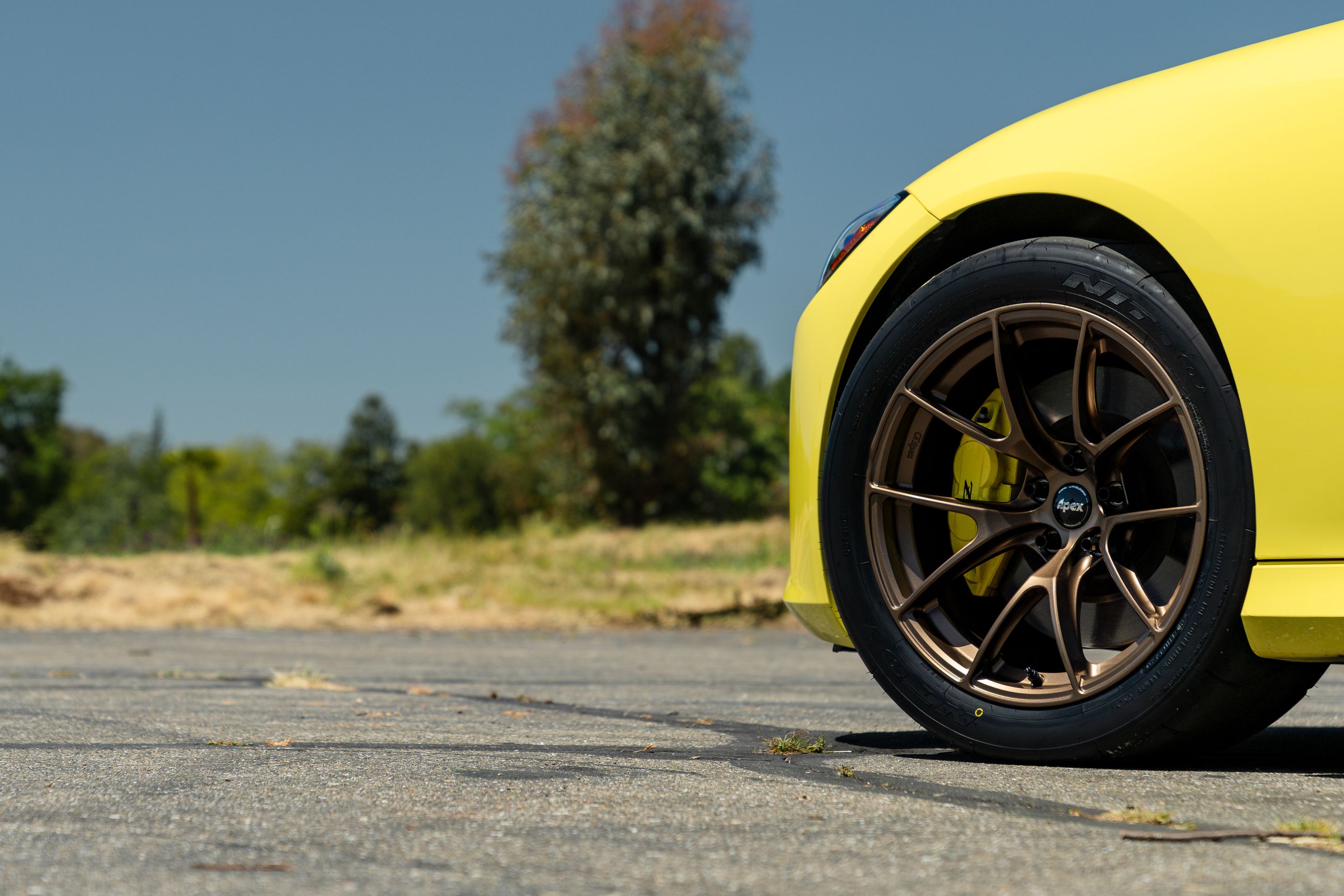 Yellow Nissan Z with 18" VS-5RS Apex wheels in Satin Bronze