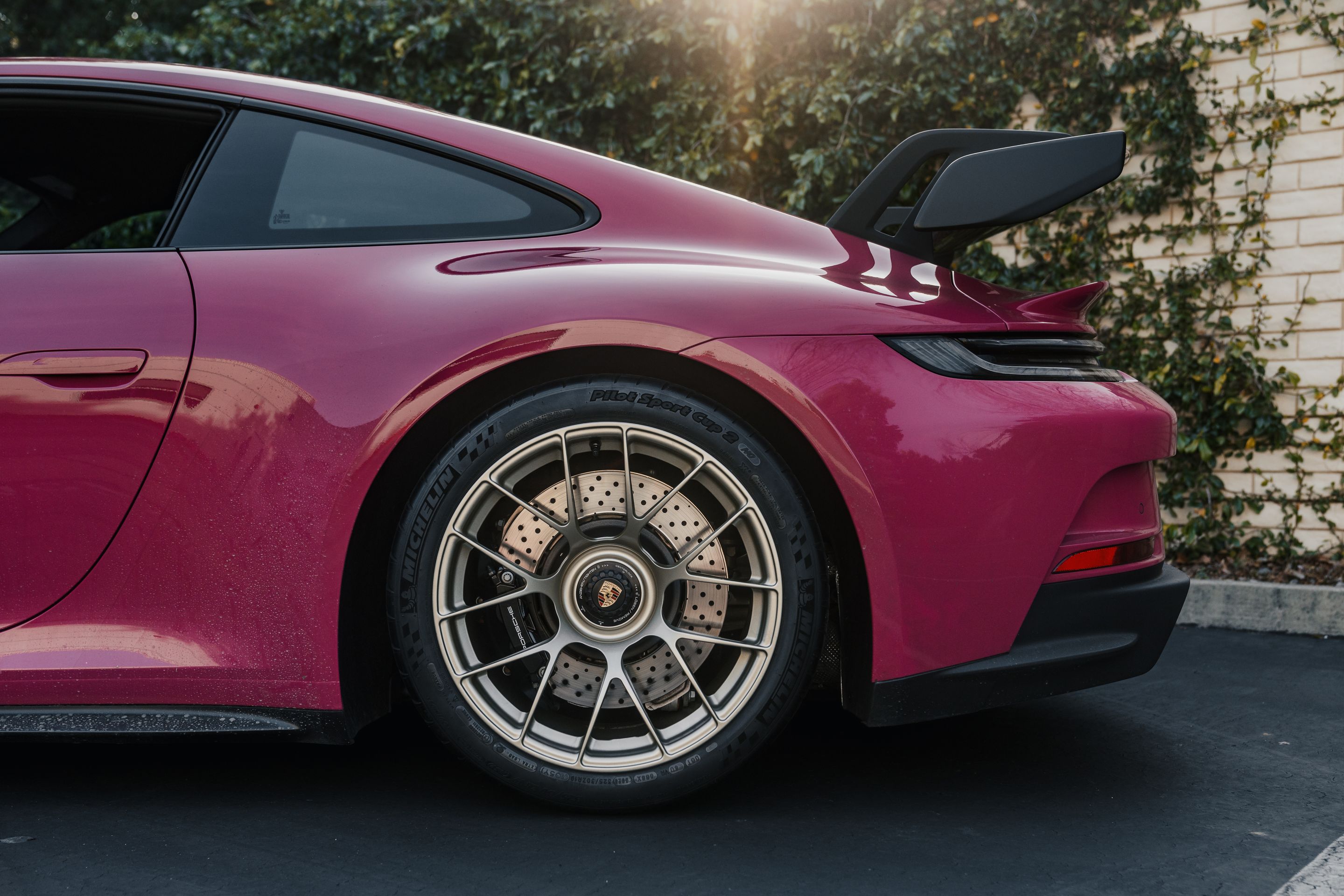 Pink Porsche 911 992.1 GT3 with 19" EC-7RS Apex wheels in Motorsport Gold
