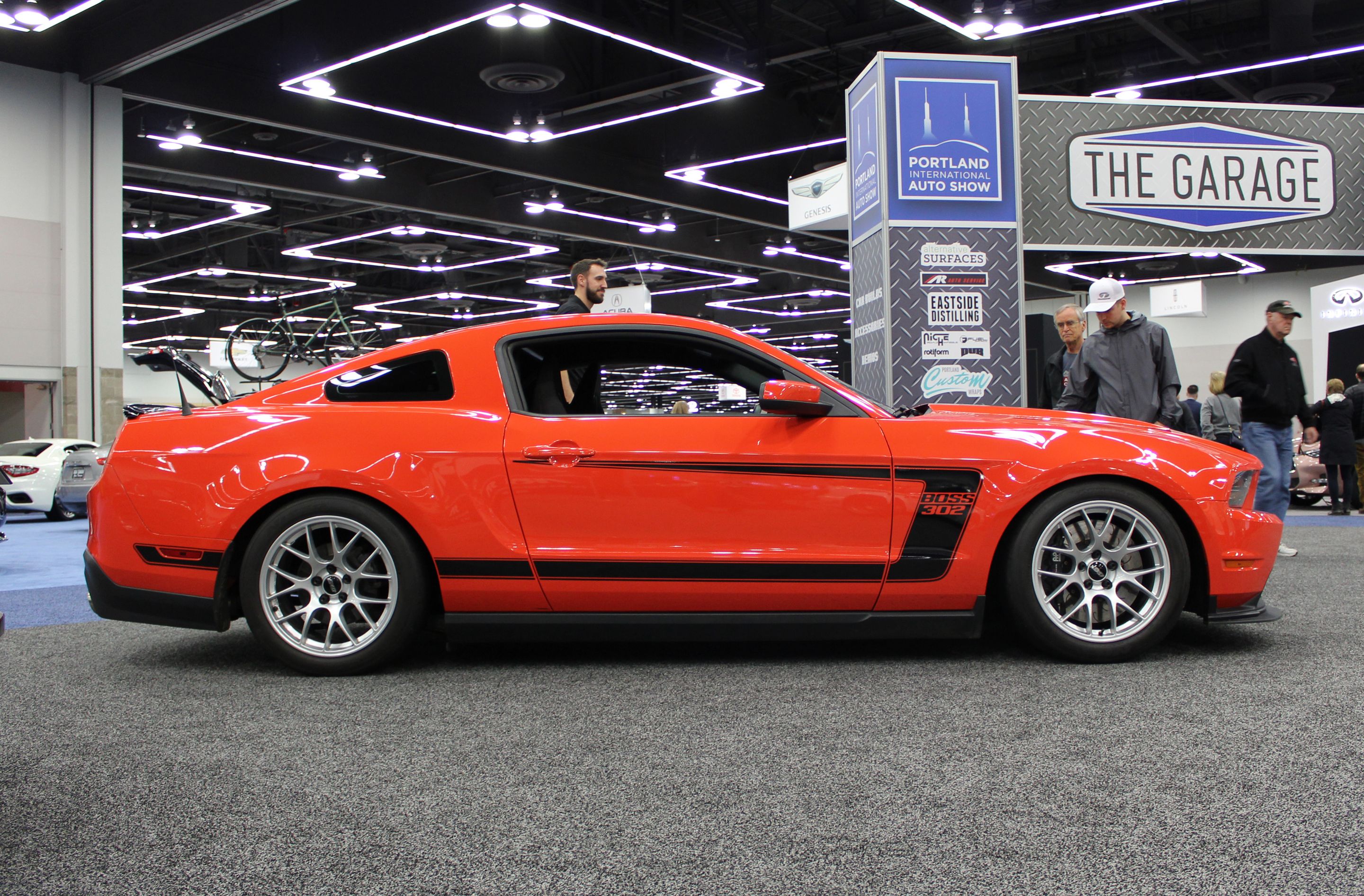 Orange Ford S197 Mustang Boss 302 with 18" EC-7 Apex wheels in Race Silver