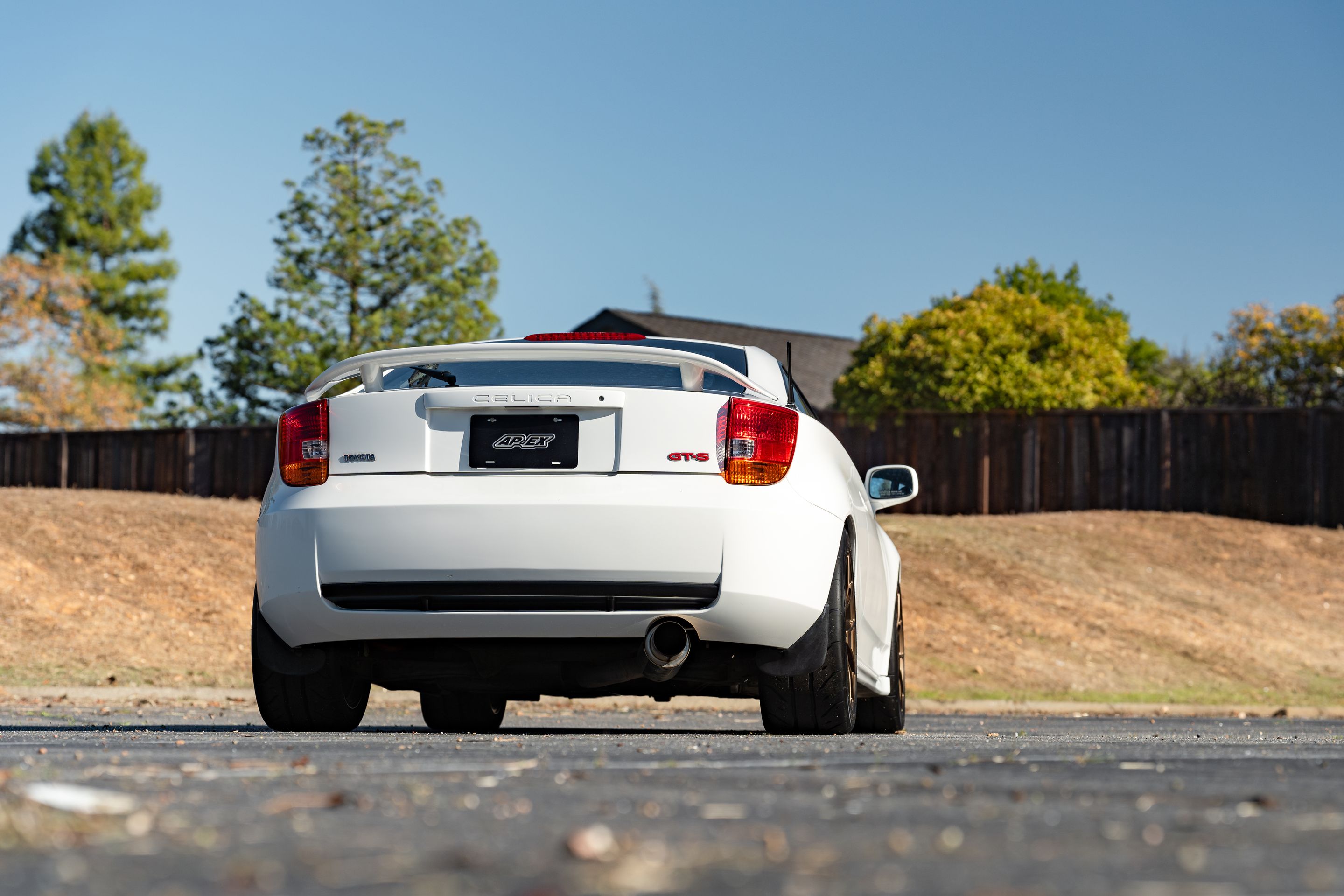 White Toyota 7th Gen Celica with 17" VS-5RS Apex wheels in Satin Bronze