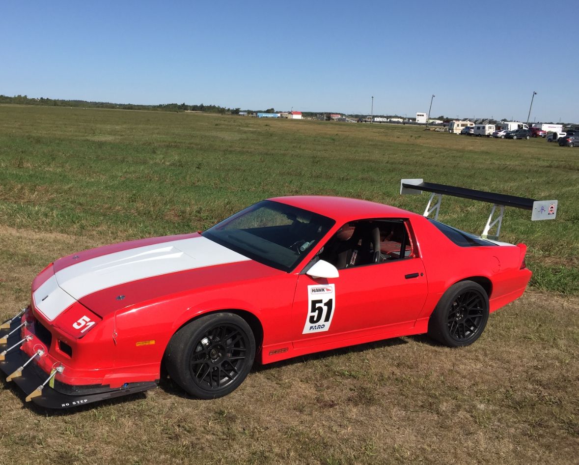 Red Chevrolet 5th Gen Camaro SS with 18" ARC-8 Apex wheels in Satin Black