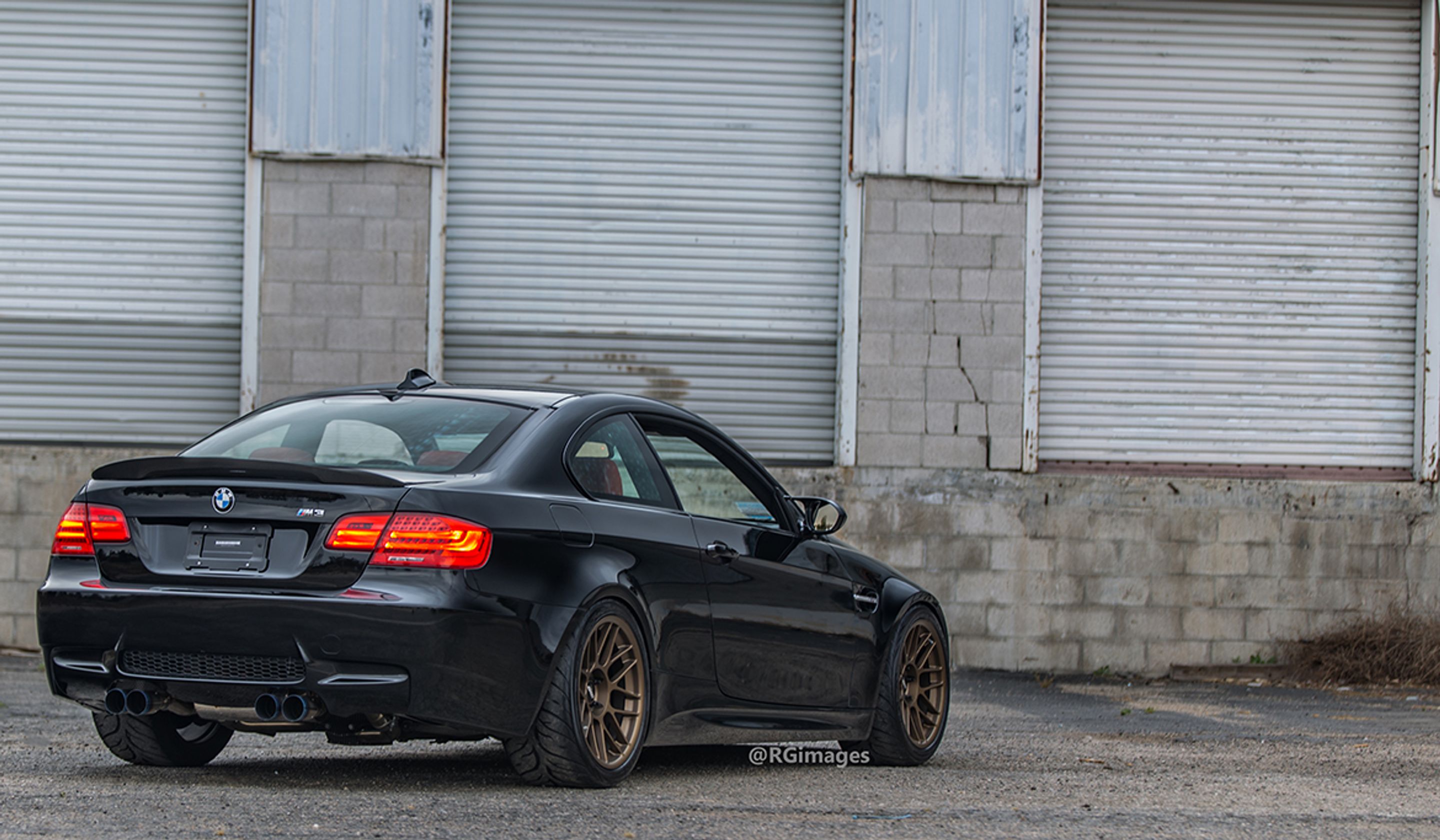 Black BMW E92 Coupe M3 with 18" ARC-8 Apex wheels in Satin Bronze