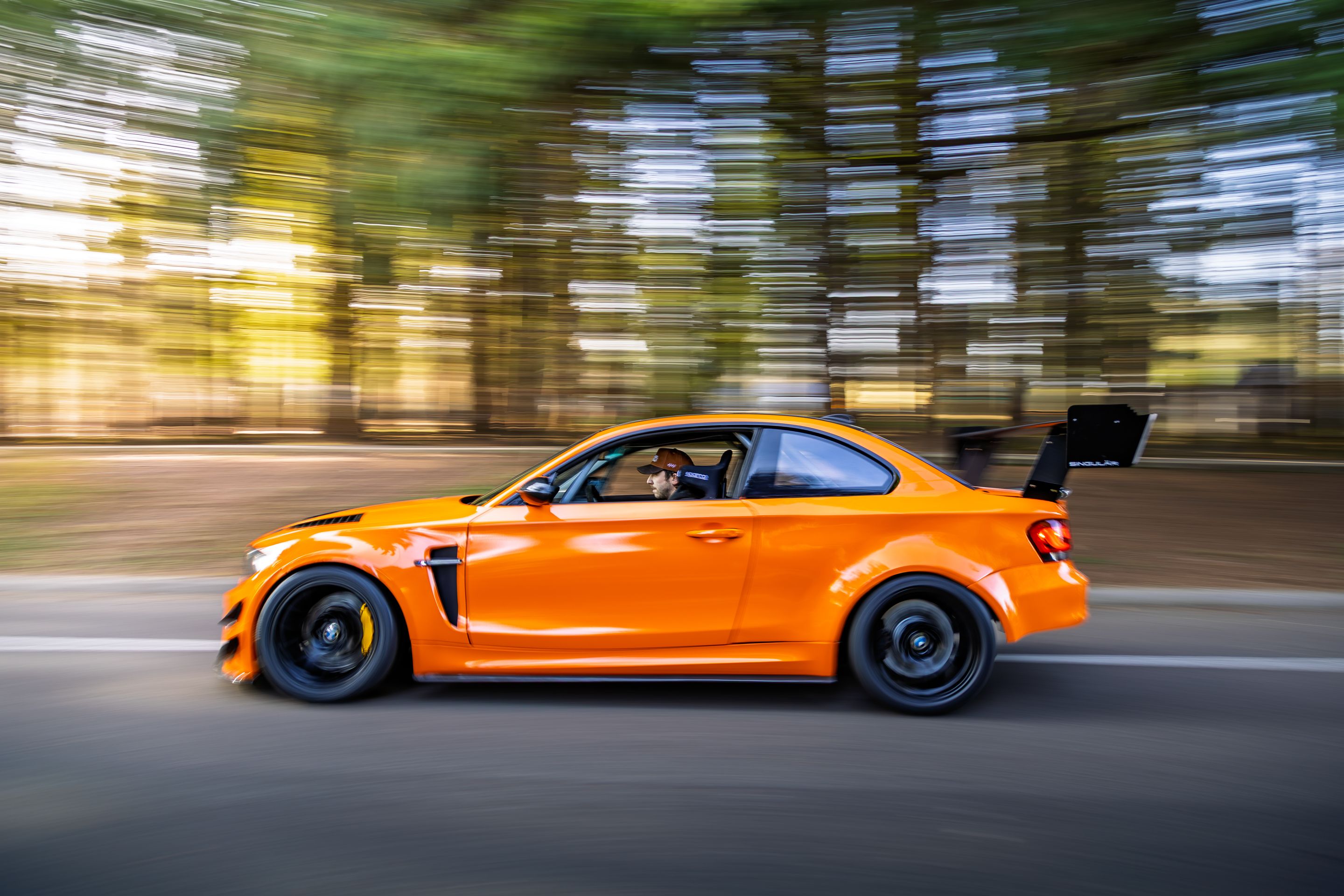 Orange BMW E82 1M with 18" EC-7 Apex wheels in Satin Black