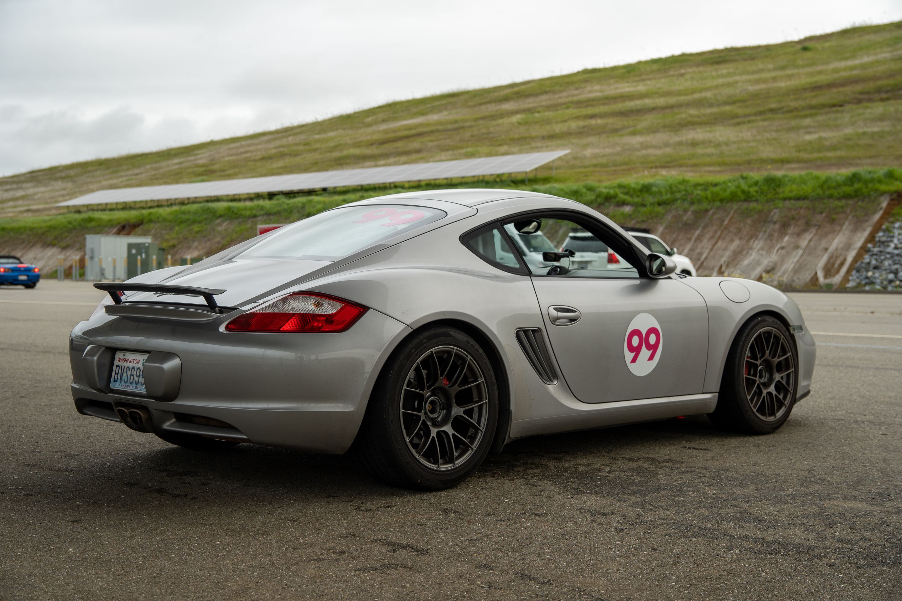 Silver Porsche 987 Cayman S with 18" EC-7RS Apex wheels in Anthracite