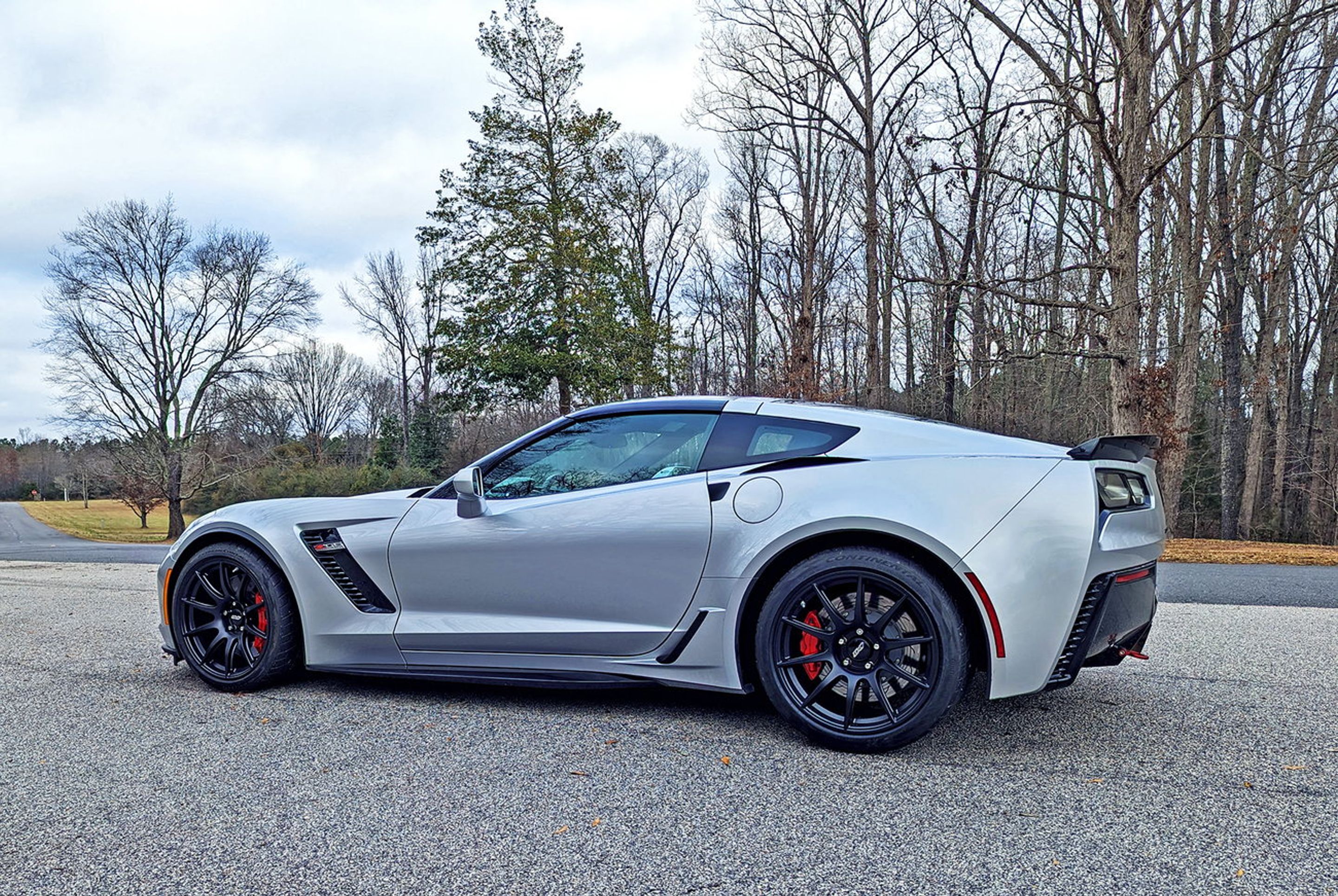 Silver Chevrolet C7 Corvette Z06 with 19" SM-10 Apex wheels in Satin Black