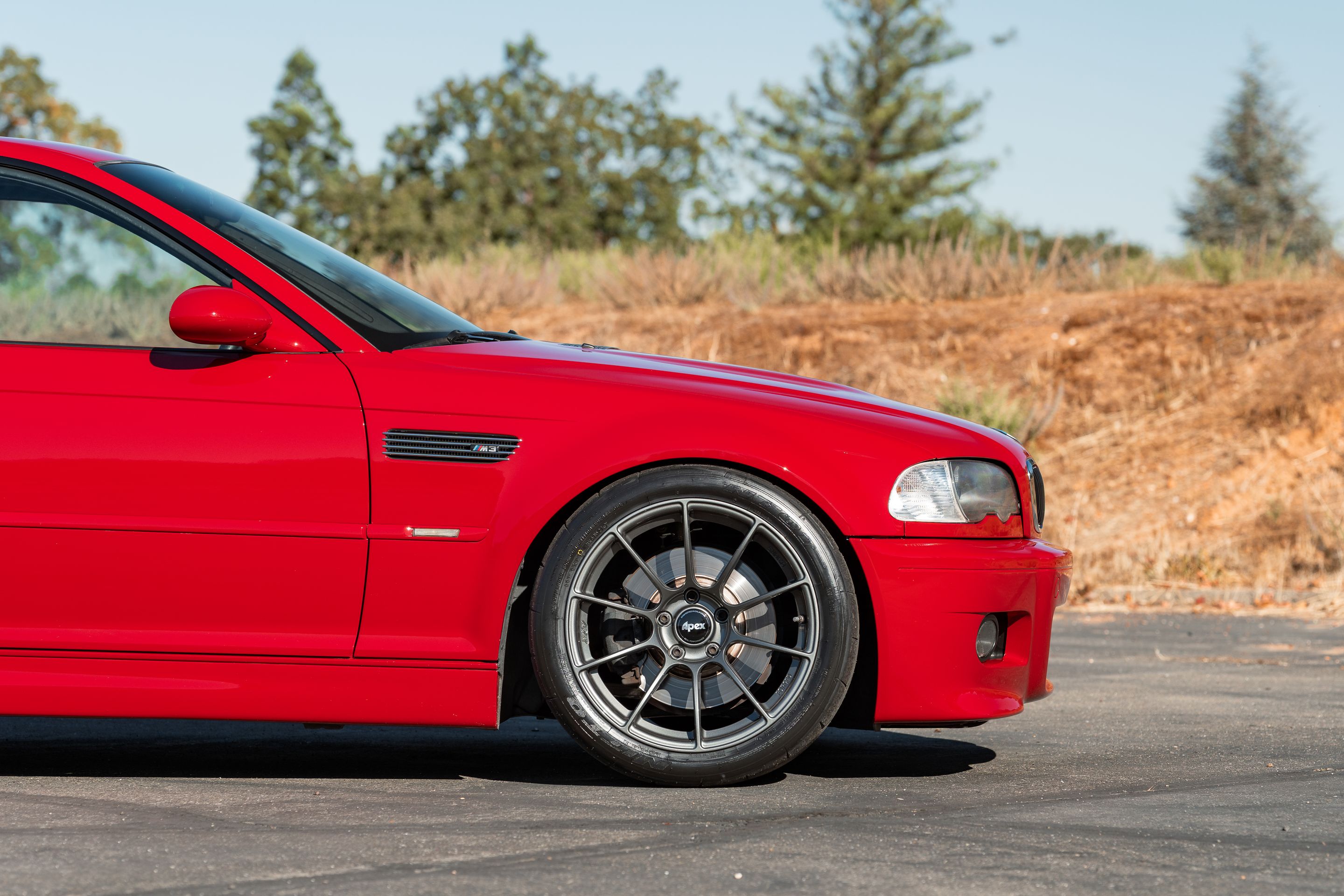 Red BMW E46 M3 with 18" SM-10RS Apex wheels in Anthracite