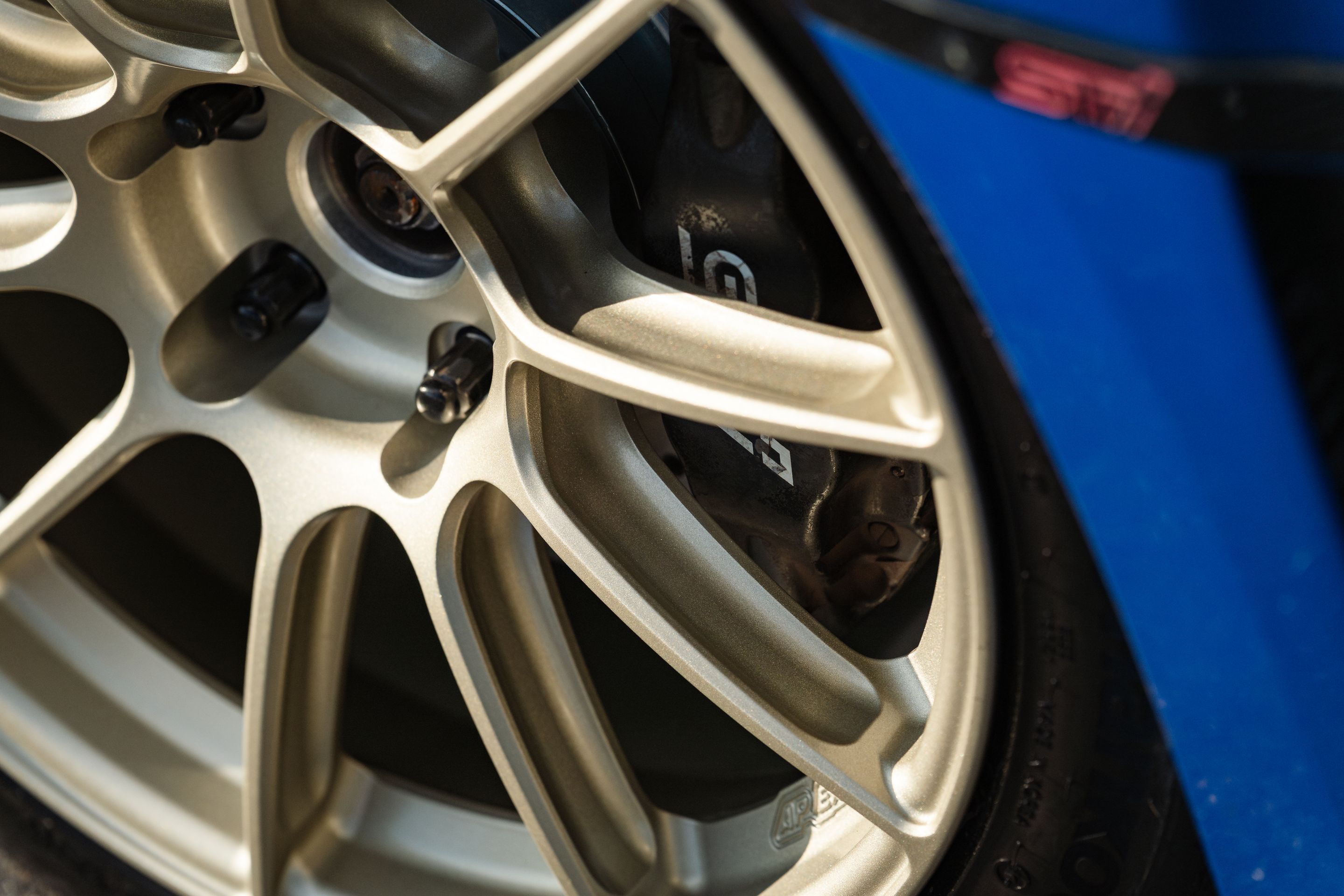 Blue Subaru GR WRX STI with 18" SM-10RS Apex wheels in Motorsport Gold