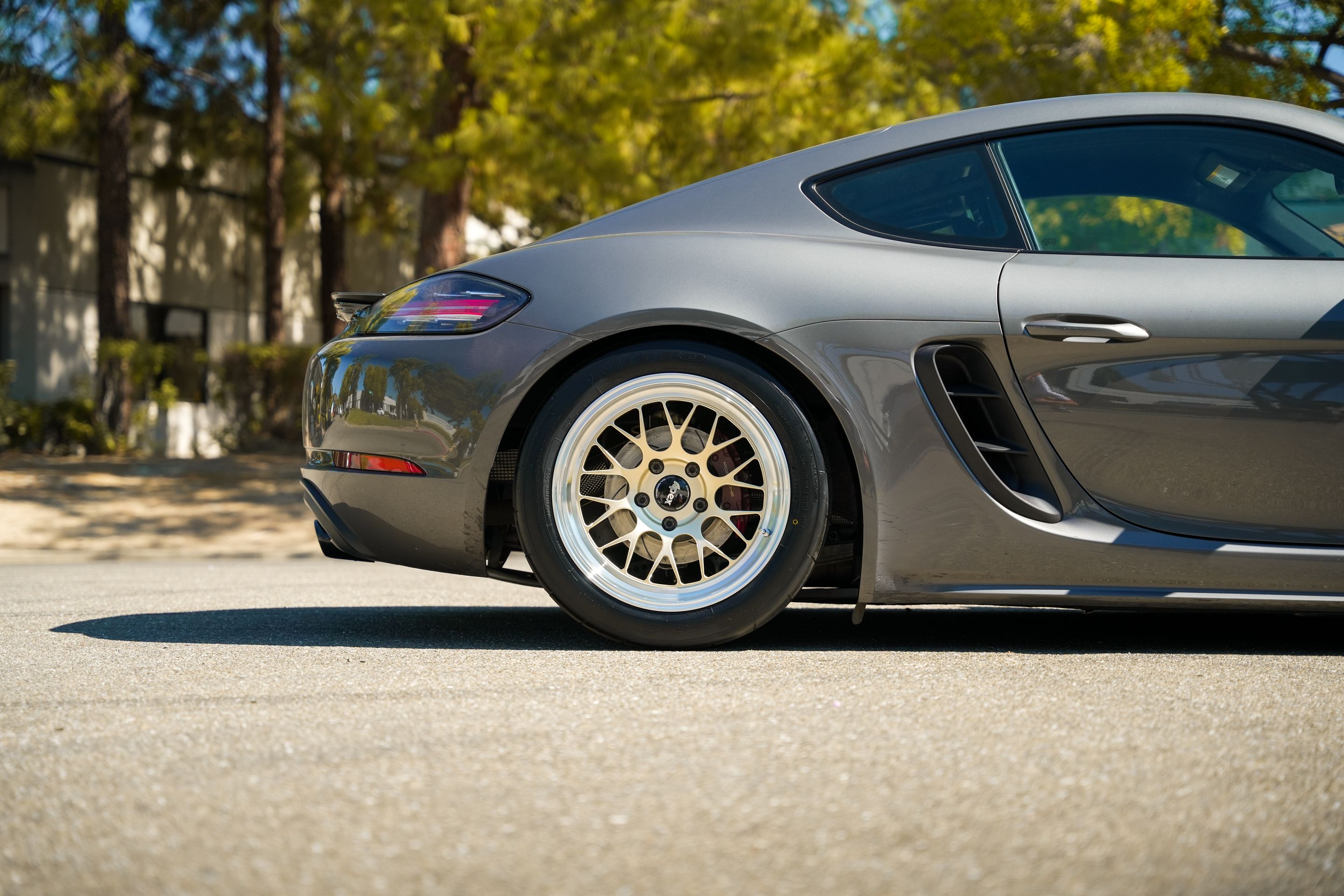 Grey Porsche 718 Cayman S with 18" ML-10RT Apex wheels in Machined Lip Gloss Motorsport Gold