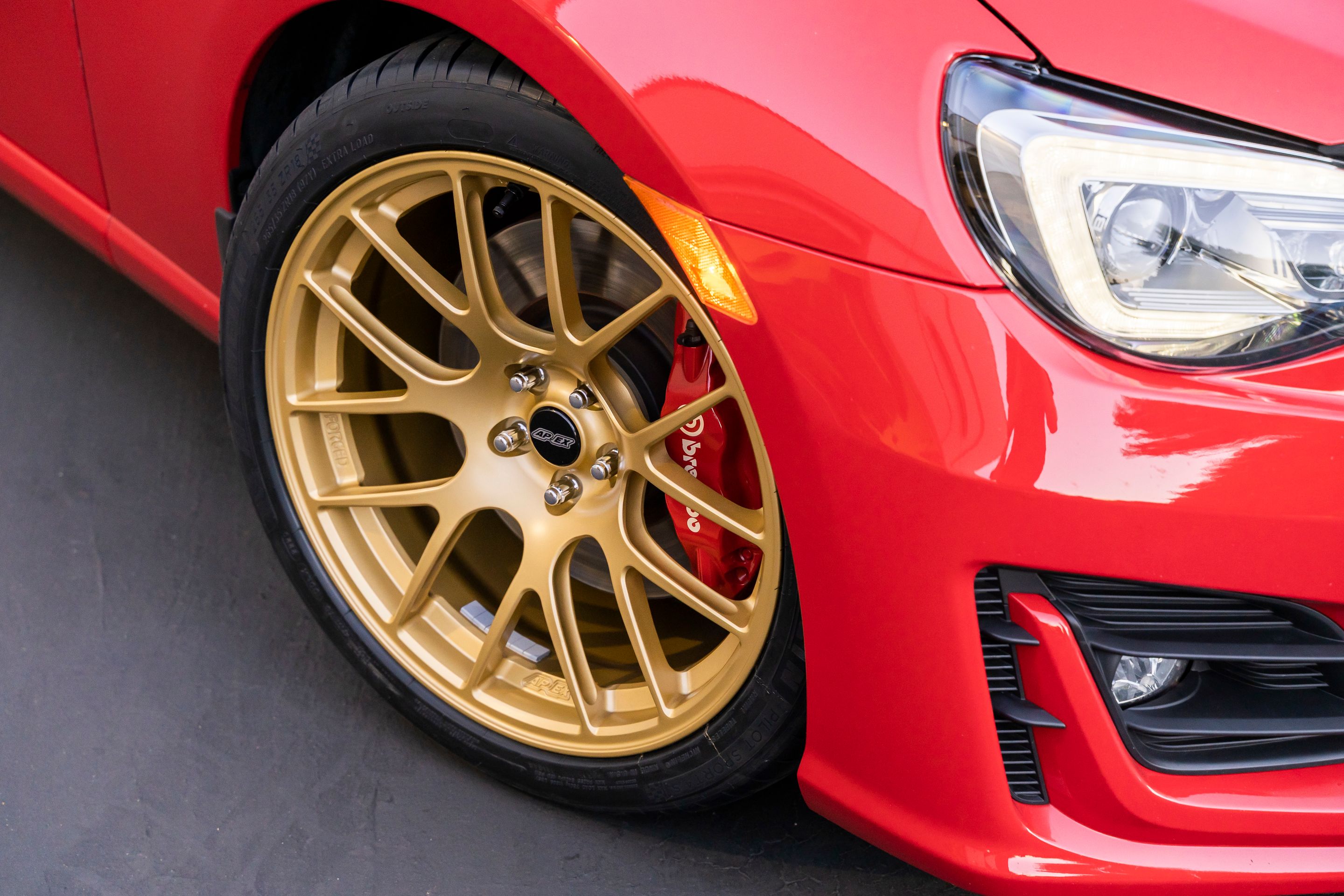 Red Subaru ZC6 / Gen 1 BRZ with 18" EC-7R Apex wheels in Satin Gold