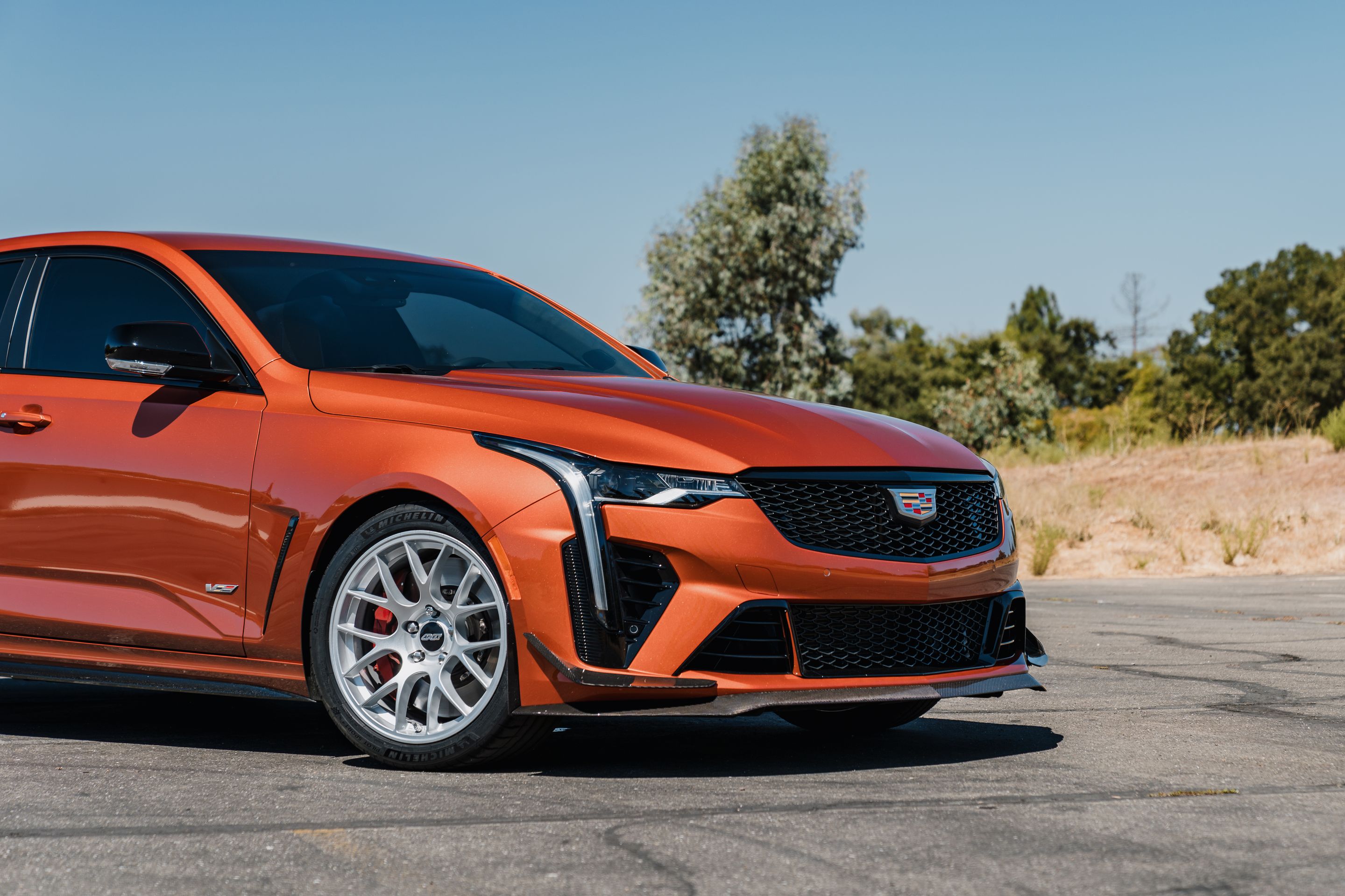 Orange Cadillac CT4-V Blackwing with 18" EC-7 Apex wheels in Race Silver