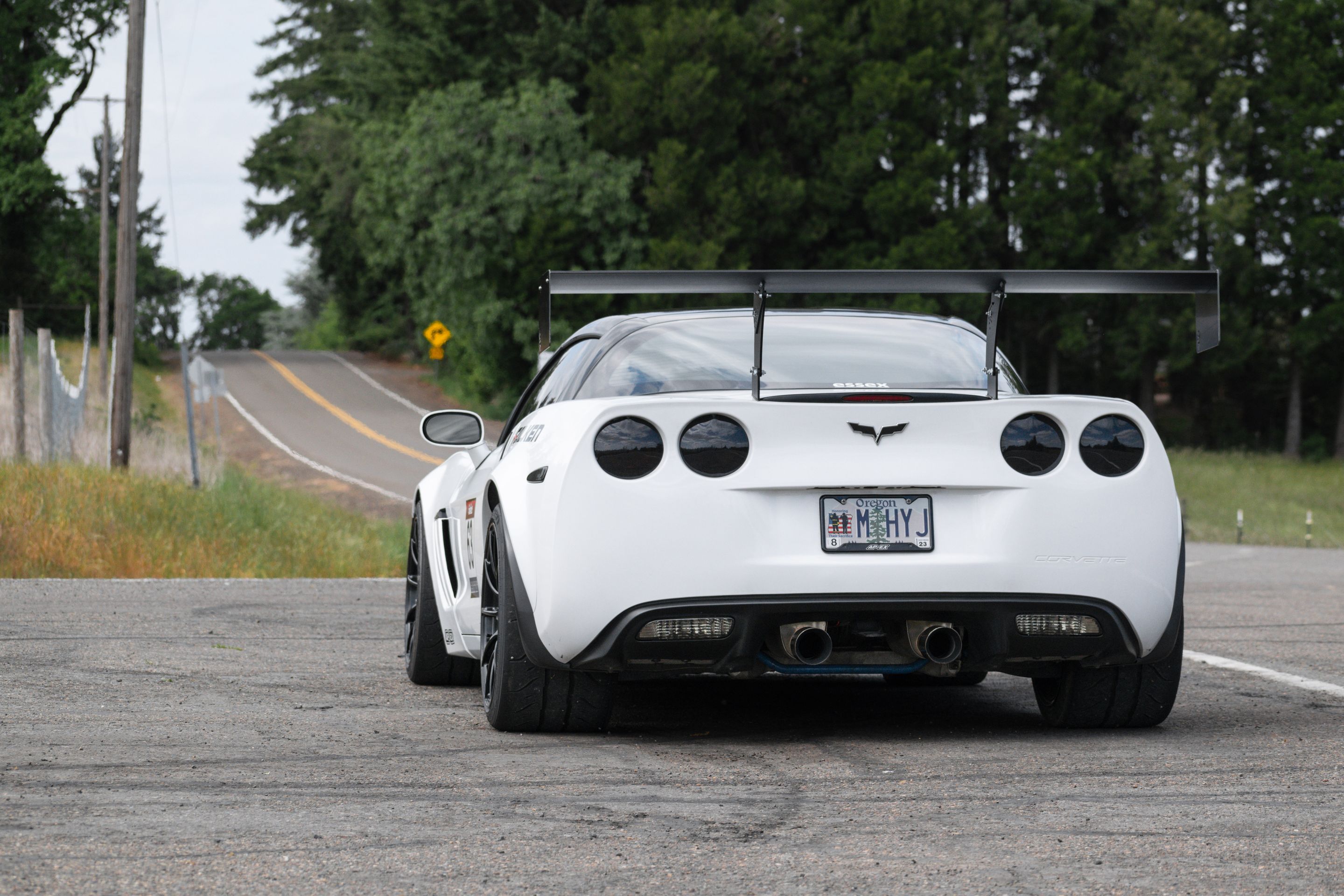 White Chevrolet C6 Corvette Grand Sport with 18"/19" SM-10RS Apex wheels in Satin Black