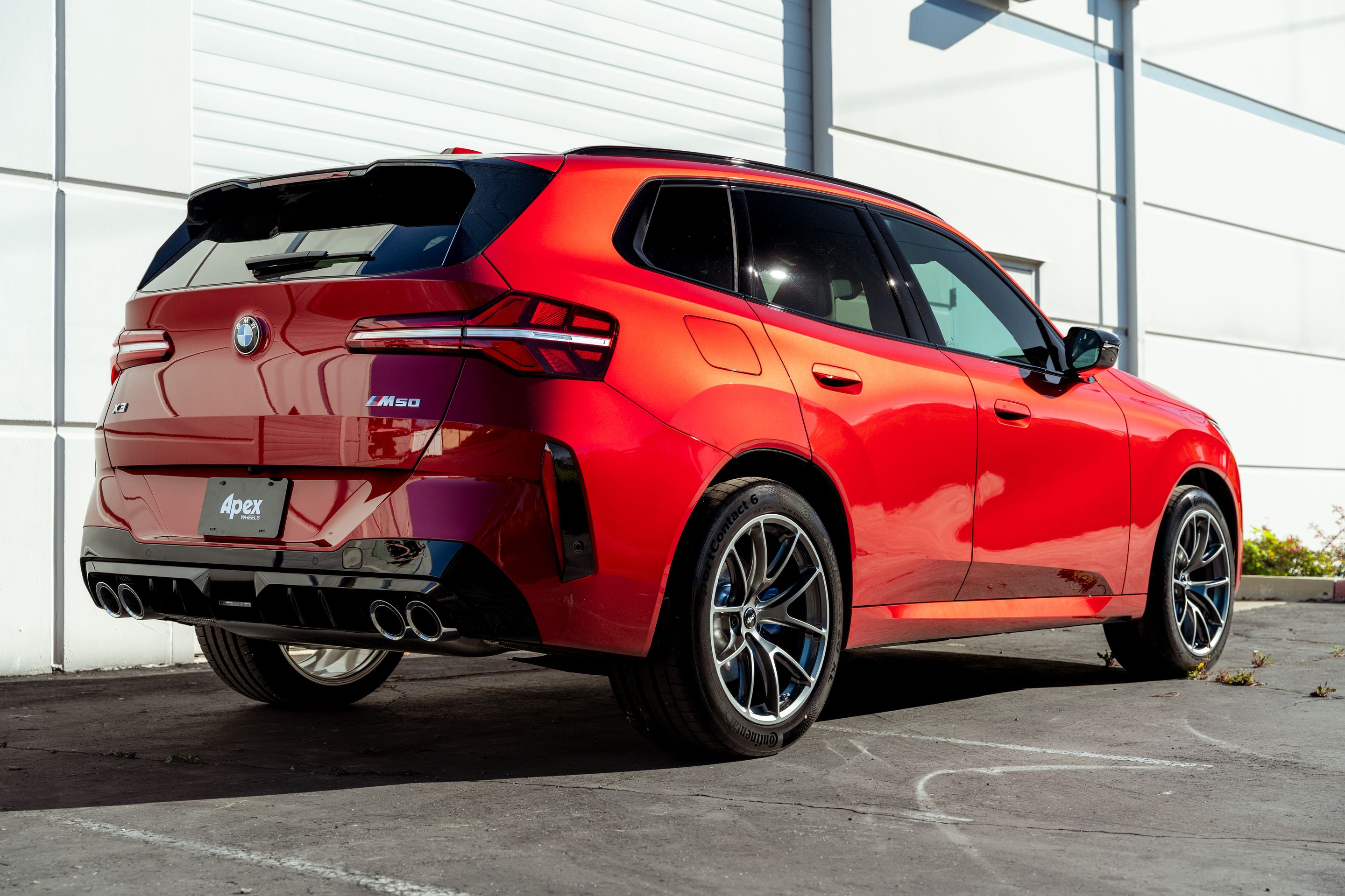 Red BMW G45 X3 with 20" VS-5RX Apex wheels in Anthracite