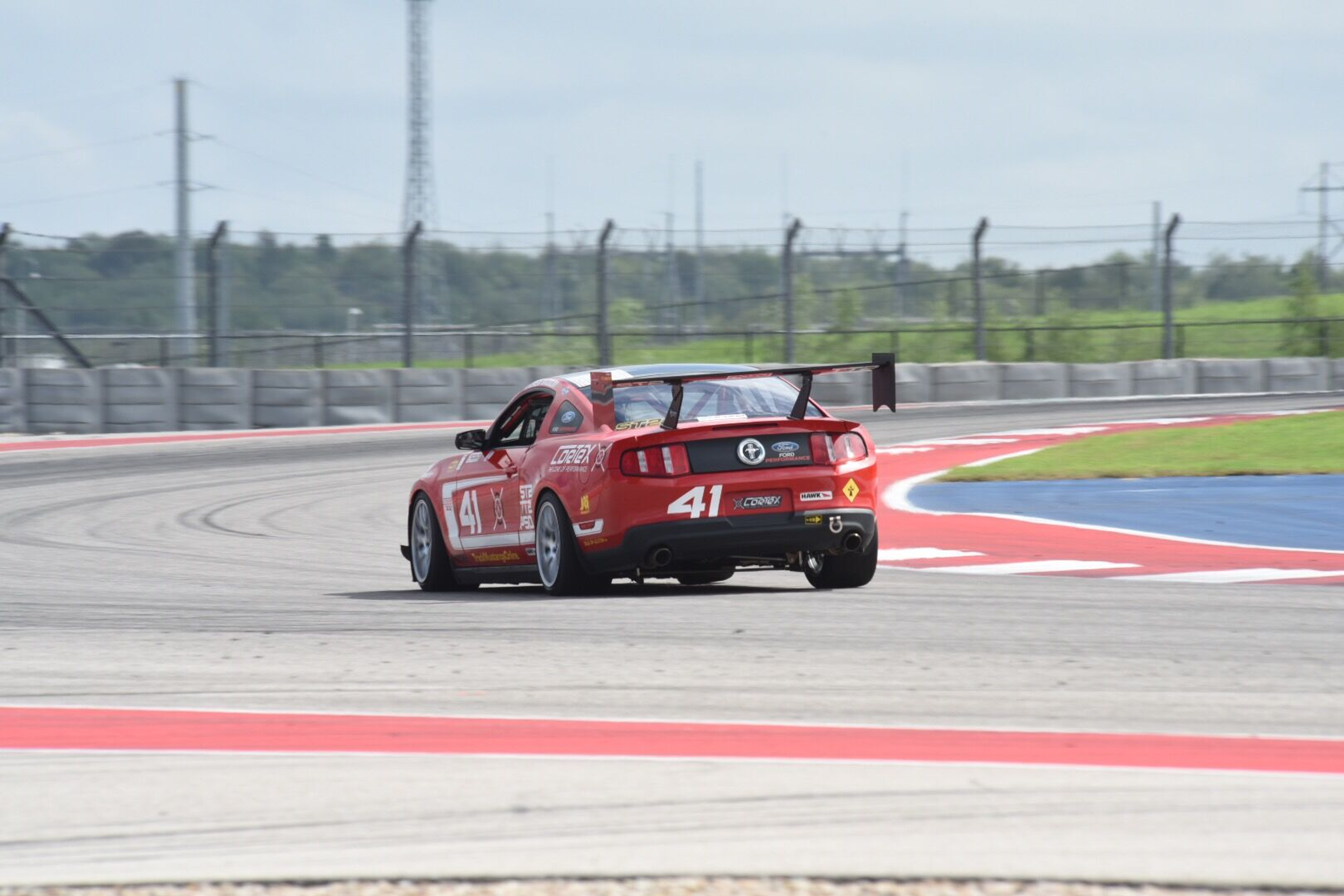 Red Ford S197 Mustang Boss 302 with 18" EC-7 Apex wheels in Race Silver