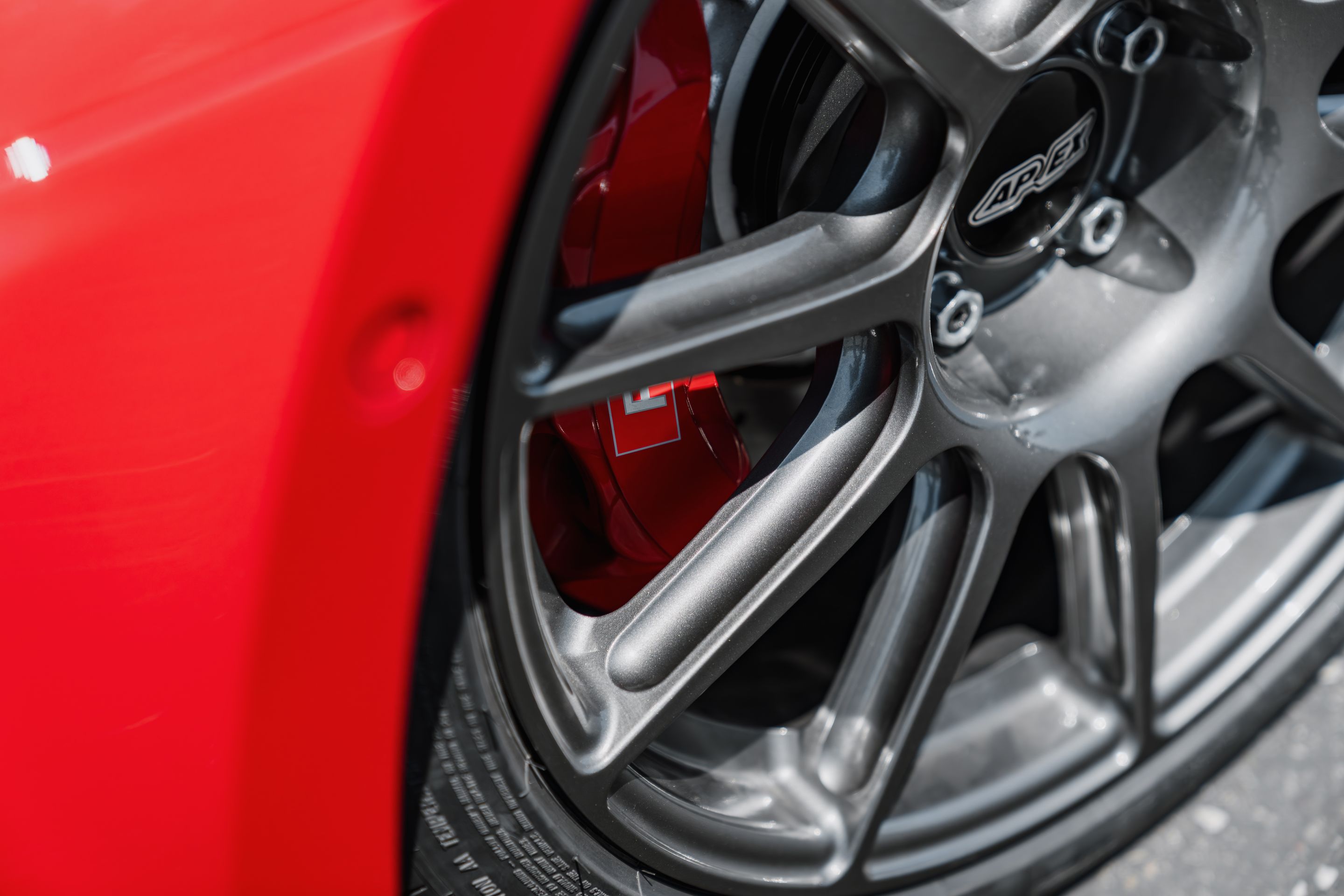 Red Audi 8Y RS 3 with 18" SM-10 Apex wheels in Anthracite