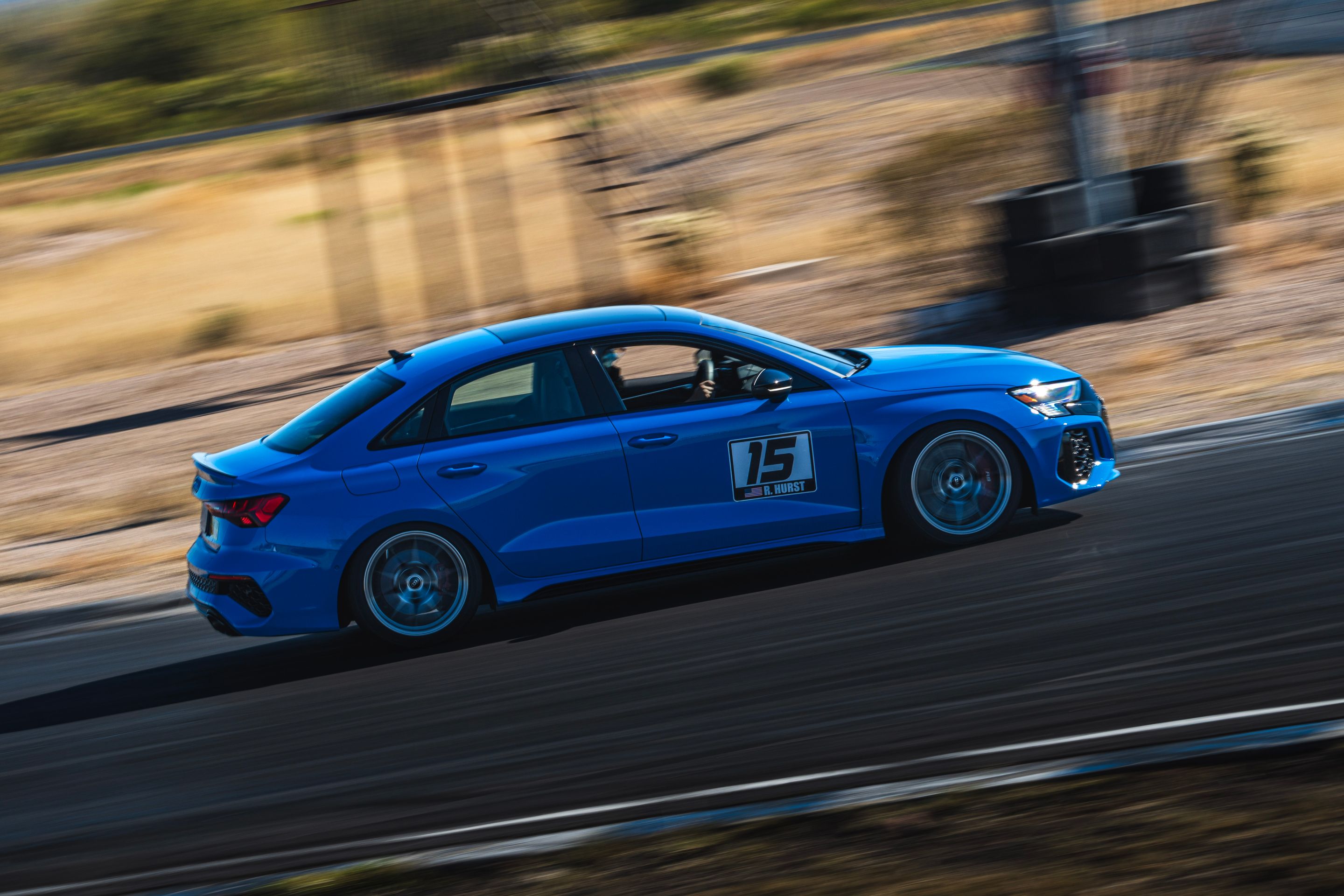 Blue Audi 8Y RS 3 with 18" VS-5RS Apex wheels in Brushed Clear