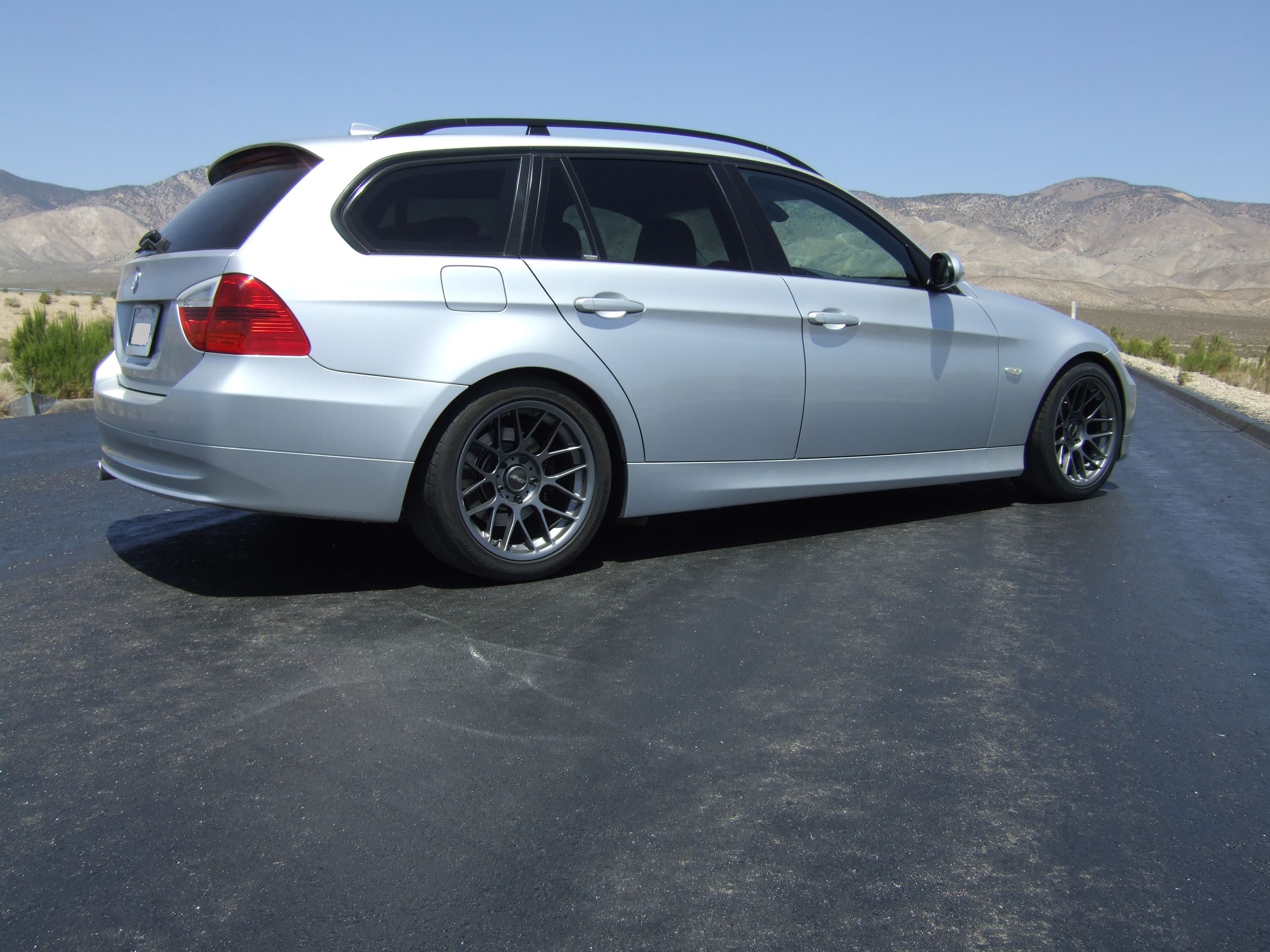 Silver BMW E91 Wagon 3 Series with 17" ARC-8 Apex wheels in Anthracite