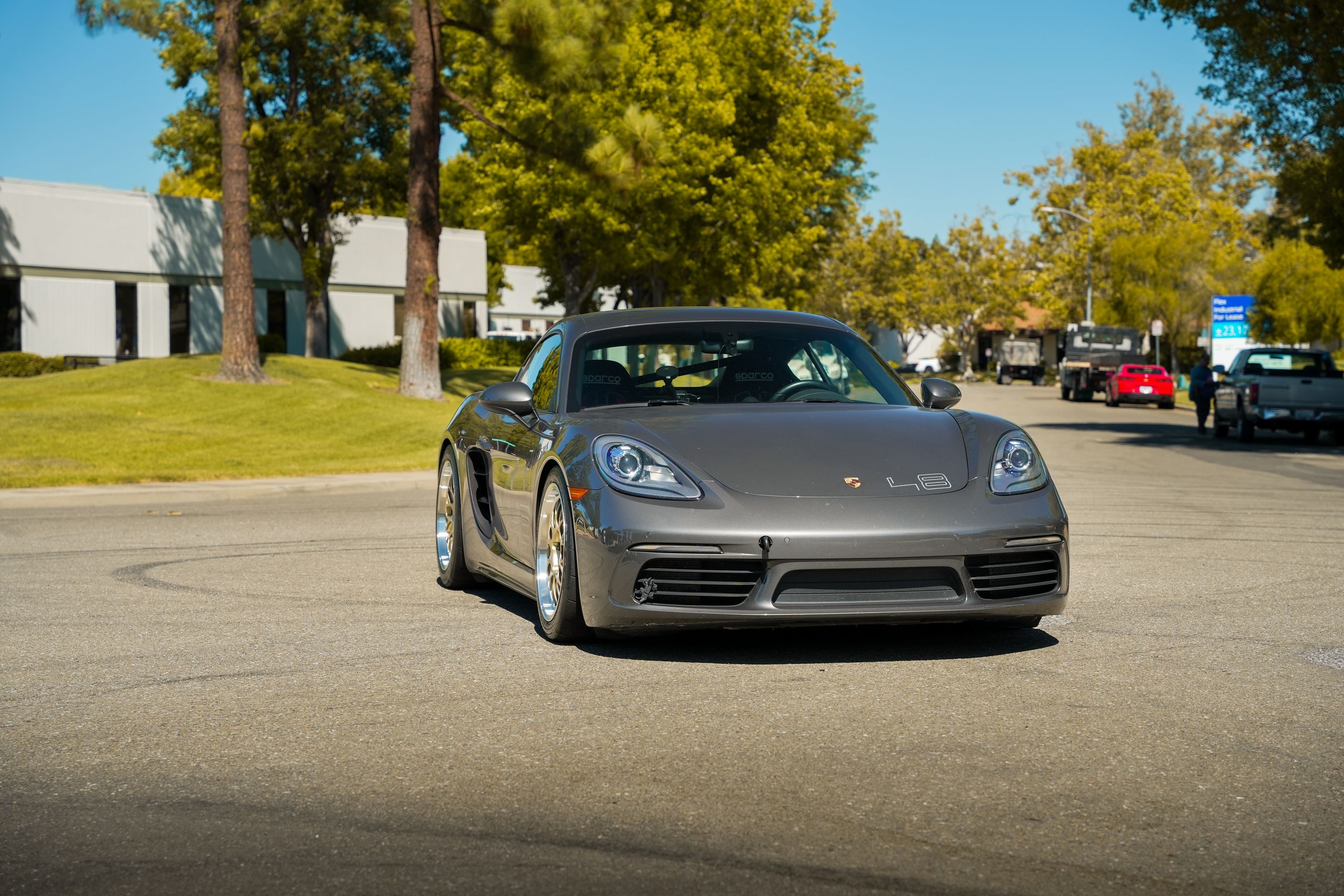 Grey Porsche 718 Cayman S with 18" ML-10RT Apex wheels in Machined Lip Gloss Motorsport Gold