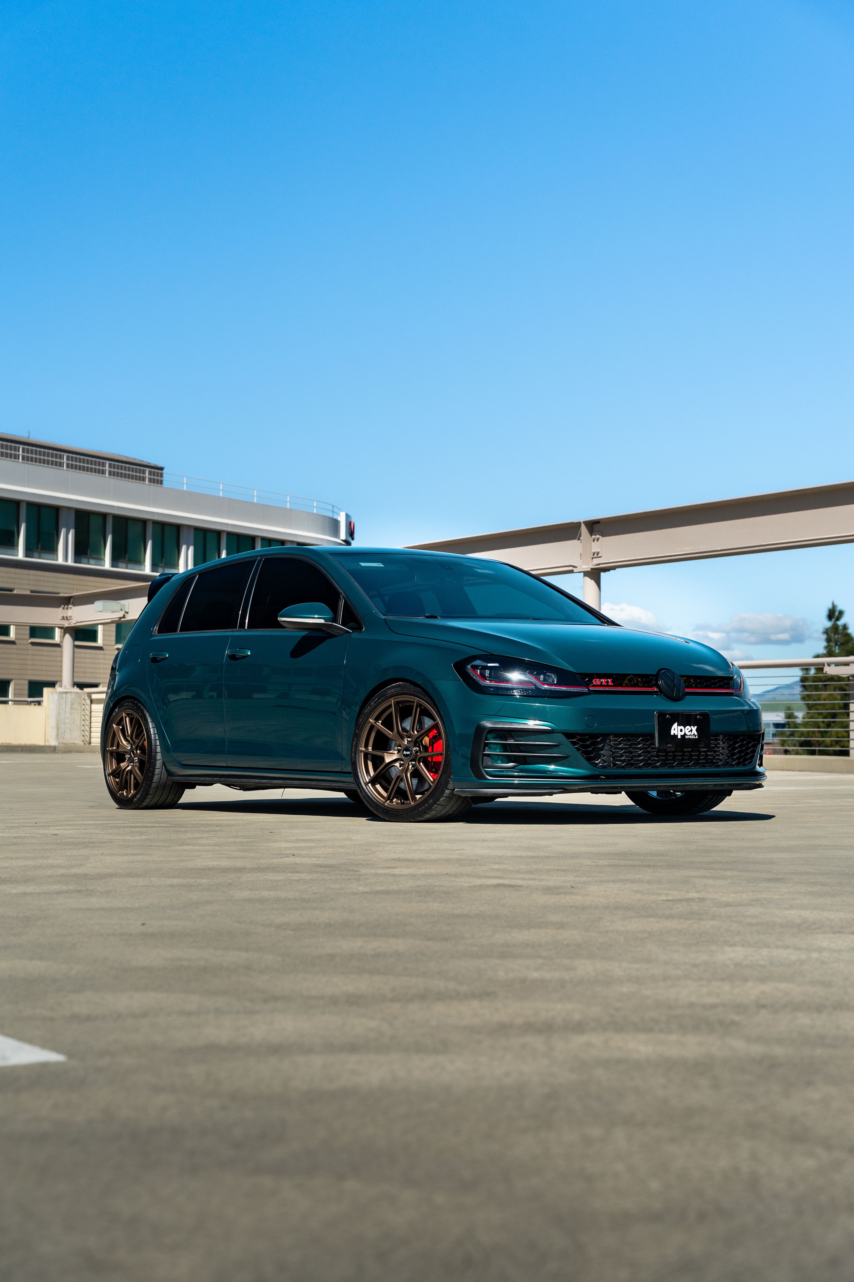 Green VW MK7 GTI with 18" VS-5 Apex wheels in Satin Bronze