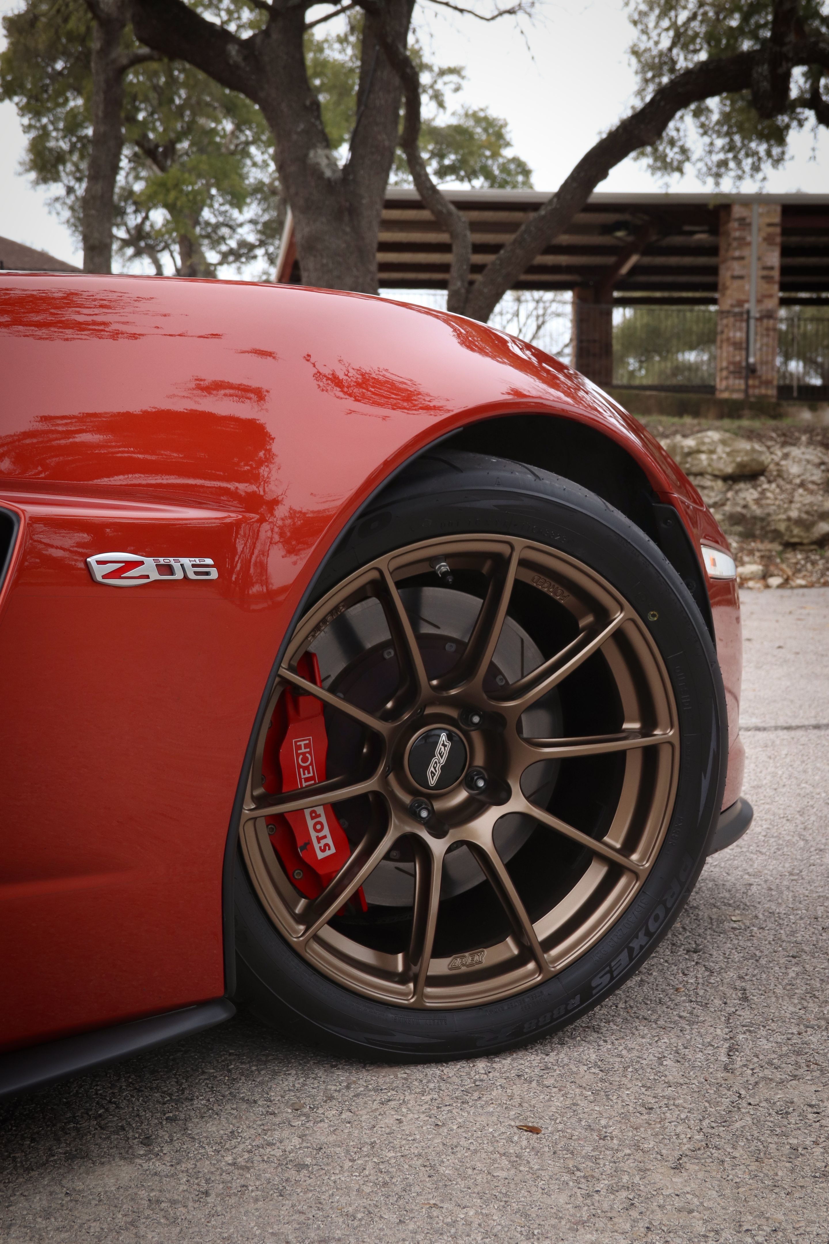 Red Chevrolet C6 Corvette Z06 with 18" SM-10RS Apex wheels in Satin Bronze