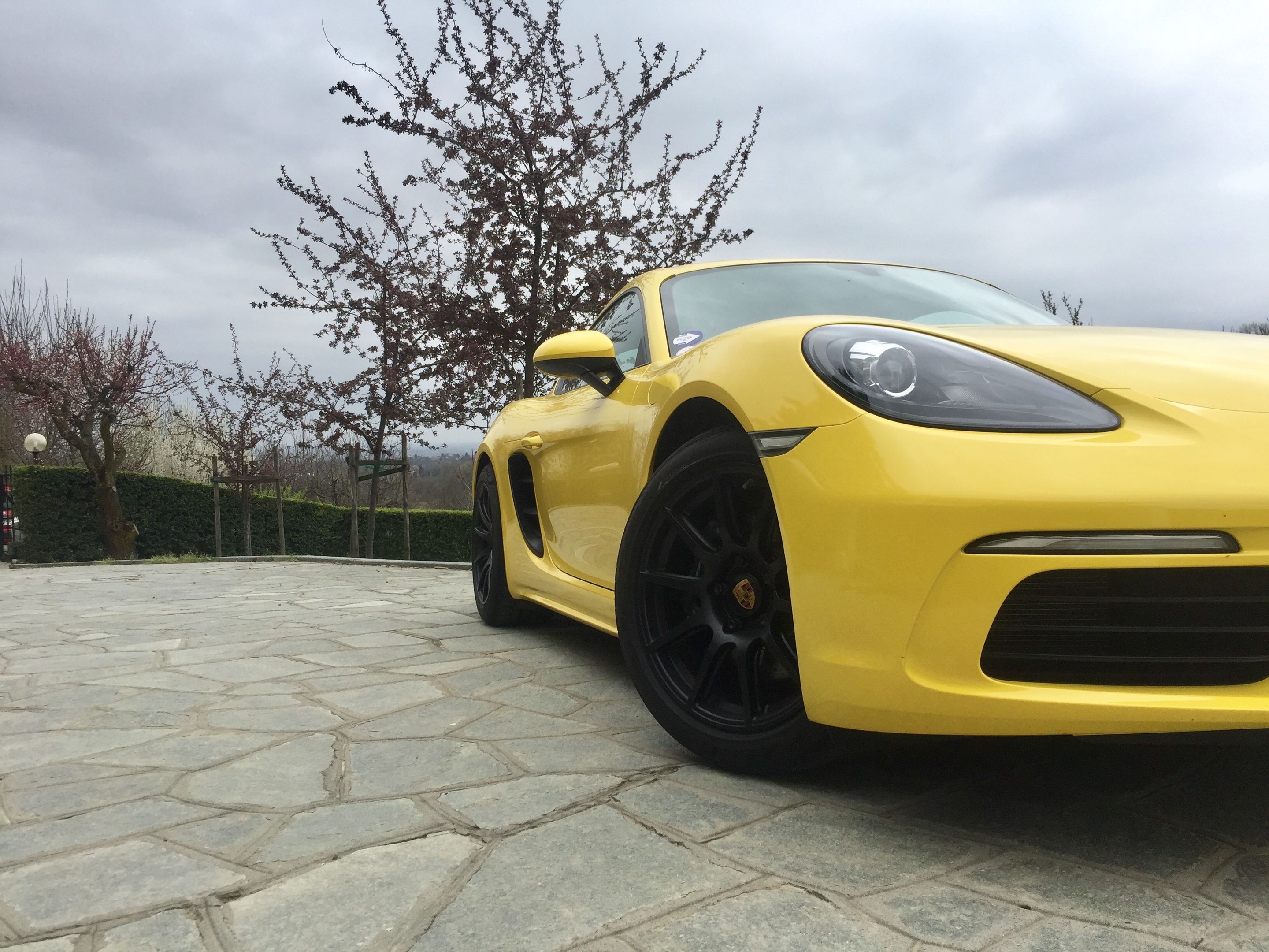 Yellow Porsche 718 Cayman Base with 18" SM-10 Apex wheels in Satin Black
