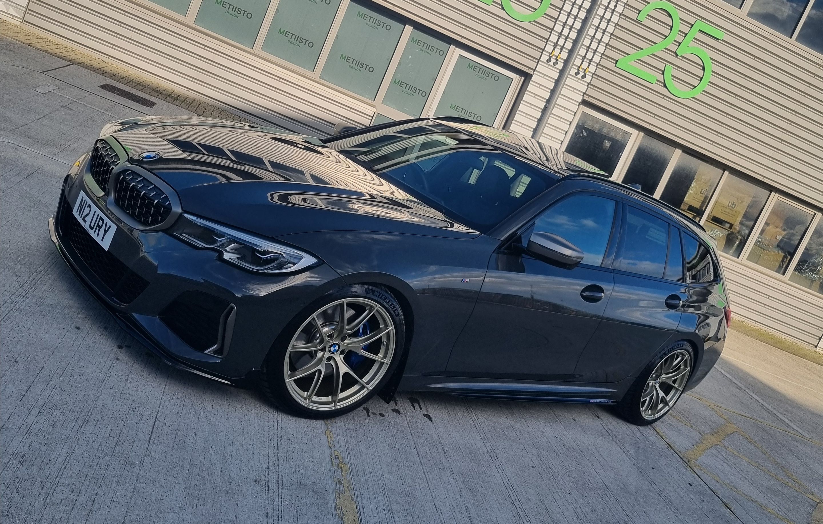 Black BMW G21 Wagon 3 Series with 19" VS-5RS Apex wheels in Motorsport Gold