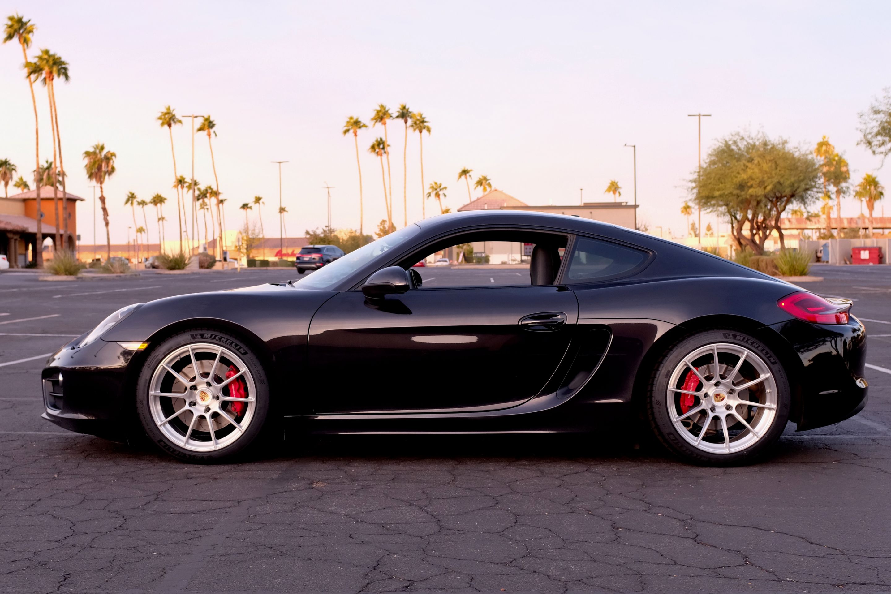 Black Porsche 981 Cayman S with 19" SM-10RS Apex wheels in Brushed Clear