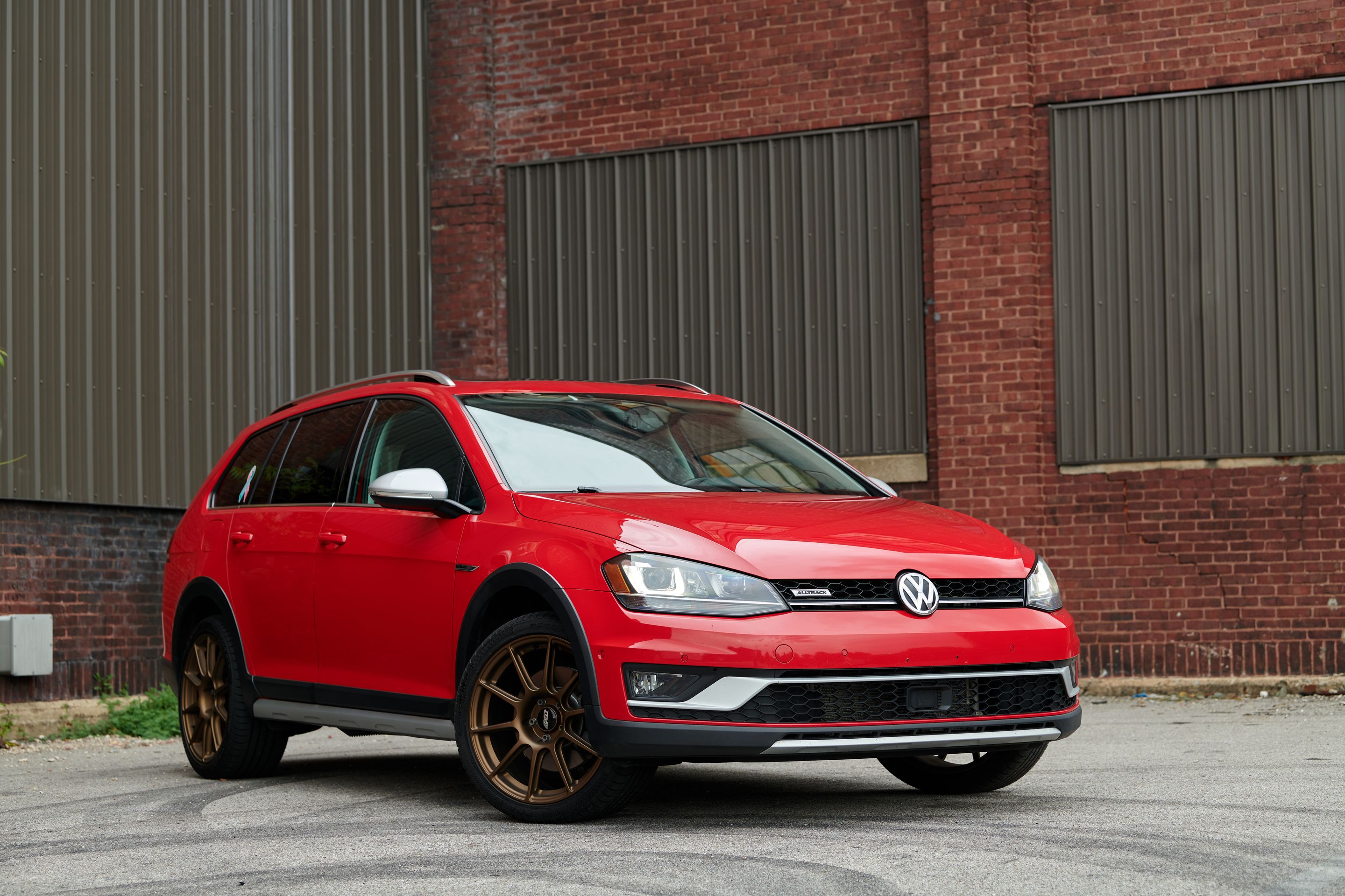 Red VW MK7 Alltrack/SportWagen Alltrack with 18" SM-10 Apex wheels in Satin Bronze