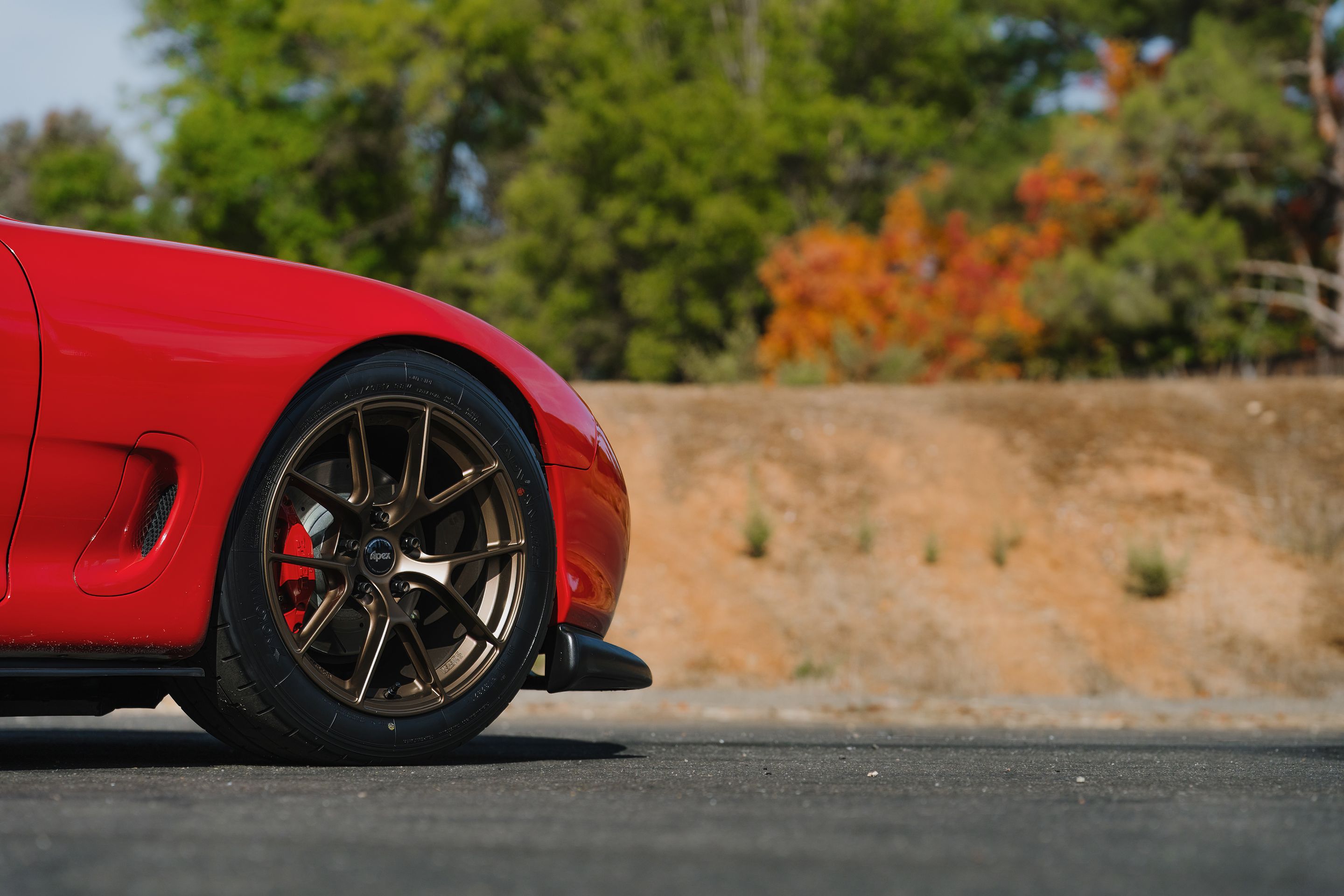 Red Mazda FD RX-7 with 17" VS-5RS Apex wheels in Satin Bronze