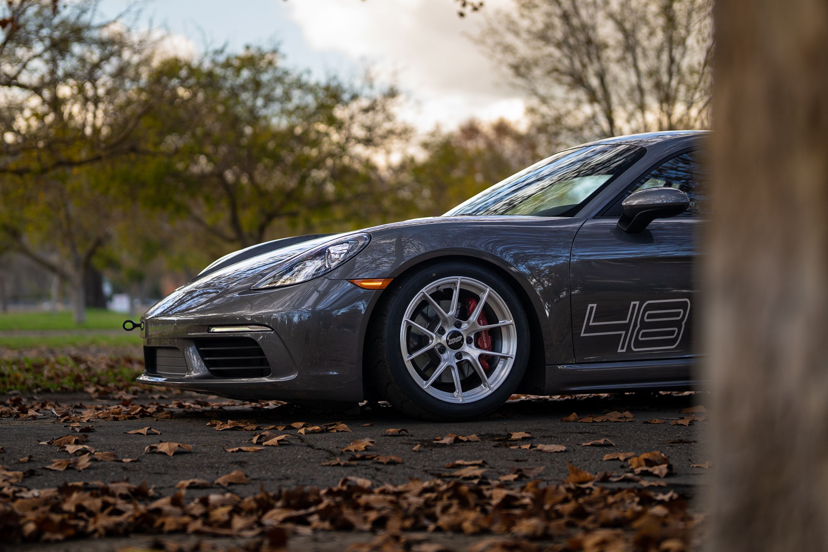 Grey Porsche 718 Cayman S with 18" VS-5RS Apex wheels in Brushed Clear